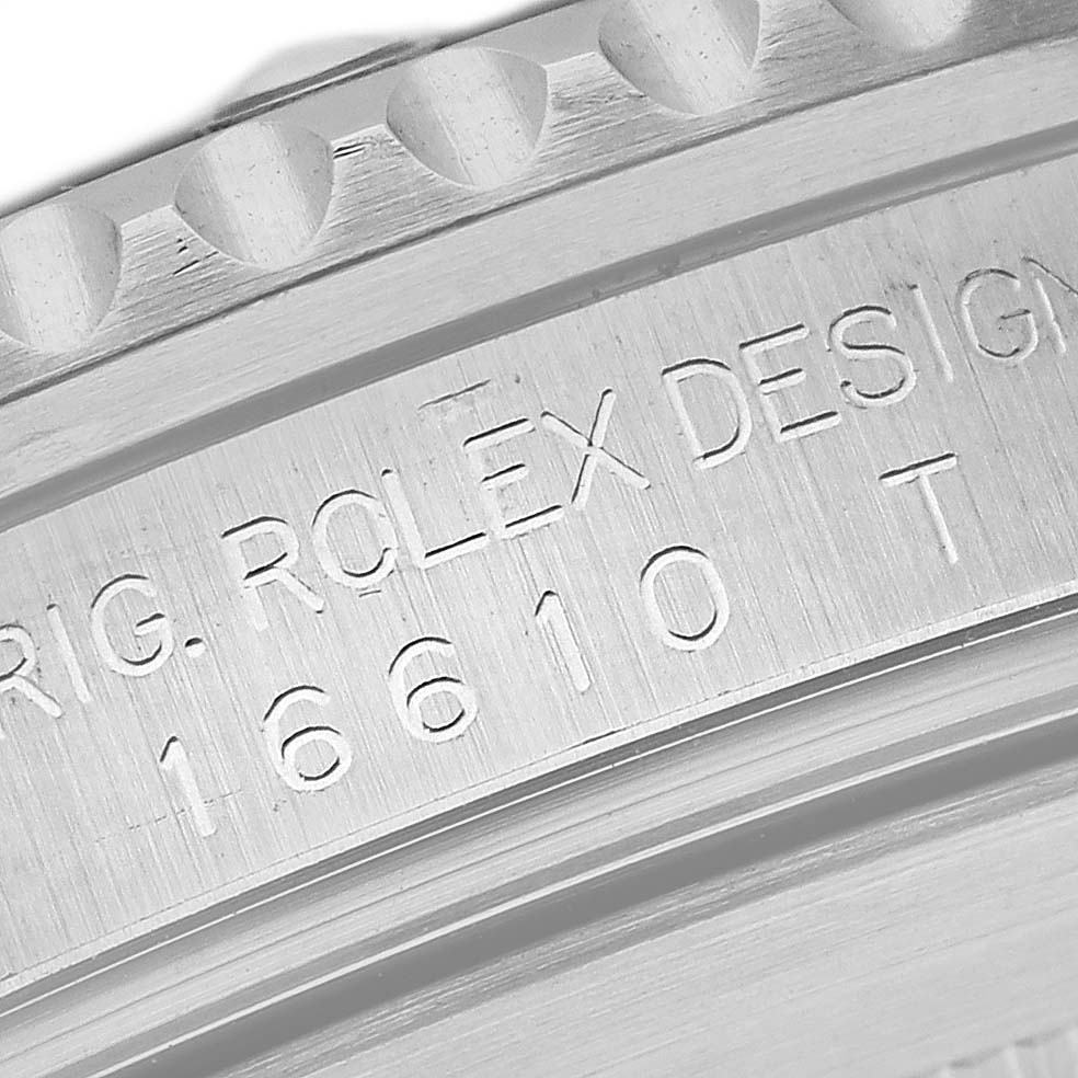 The image shows a close-up view of the engraved serial number and branding on the side of a Rolex Submariner 16610 Men
s Stainless Steel Black Dial 16610 Men
s Stainless Steel Black Dial model.