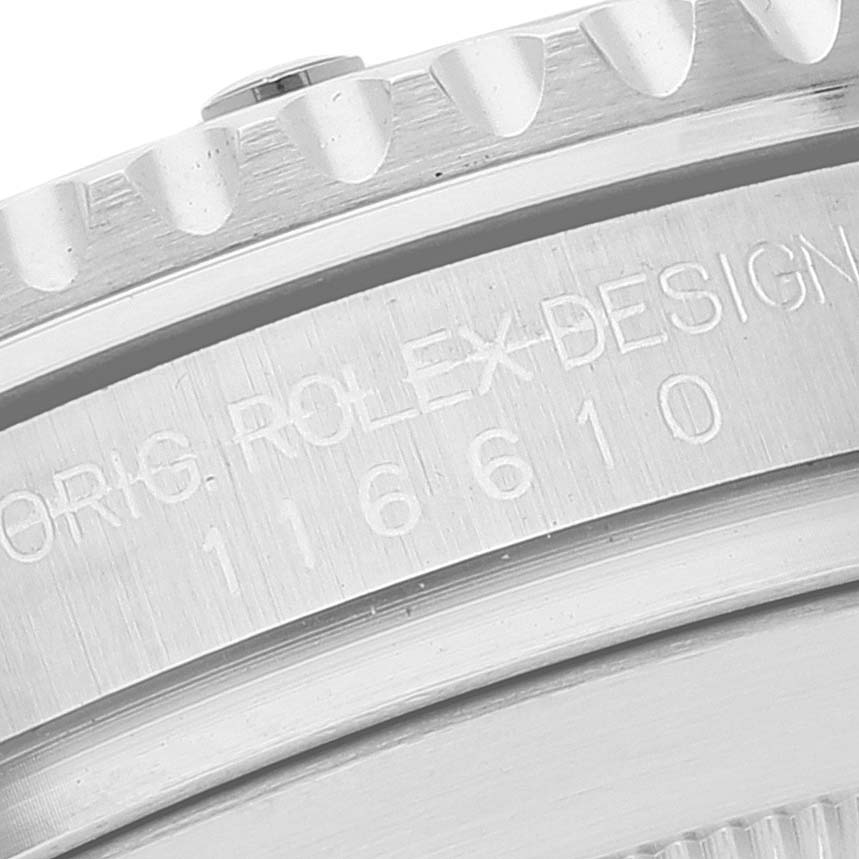 The image shows a close-up of the Rolex Submariner 116610LV Men
s Stainless Steel Green Dial 116610LV Men
s Stainless Steel Green Dial model bezel and case side with the engraved design number 116610.