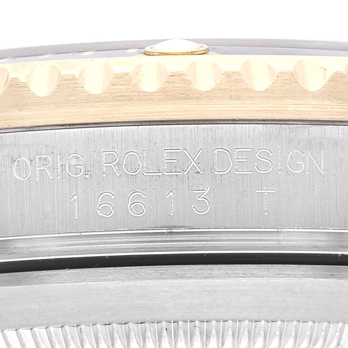 The image shows a close-up of the side inscription on the case of a Rolex Submariner 16613 Men's Steel and Gold (two tone) Black Dial 16613 Men's Steel and Gold (two tone) Black Dial model 16613T.