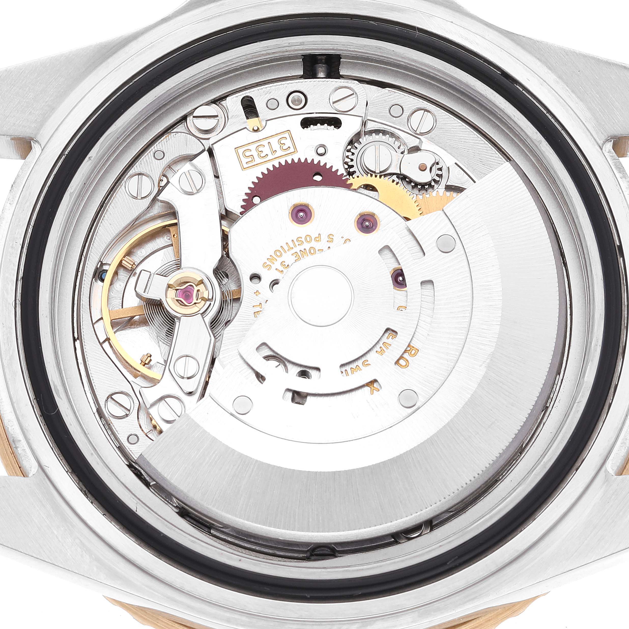 The image shows the inner mechanism and components of a Rolex Submariner 16613 Men's Steel and Gold (two tone) Black Dial 16613 Men's Steel and Gold (two tone) Black Dial watch from a back view.