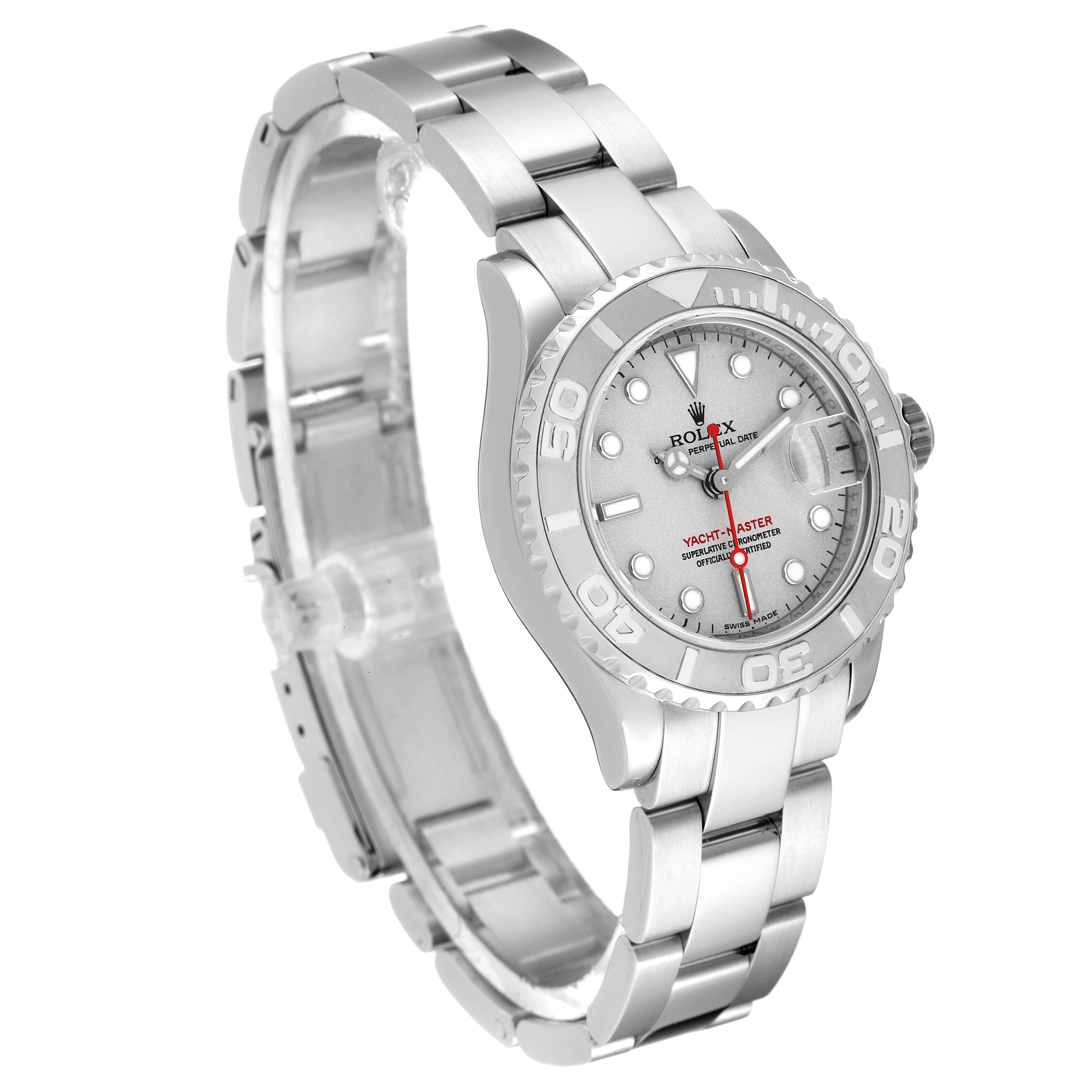 The Yacht-Master watch by Rolex is shown at an angled view displaying the full face, bezel, and metal bracelet.