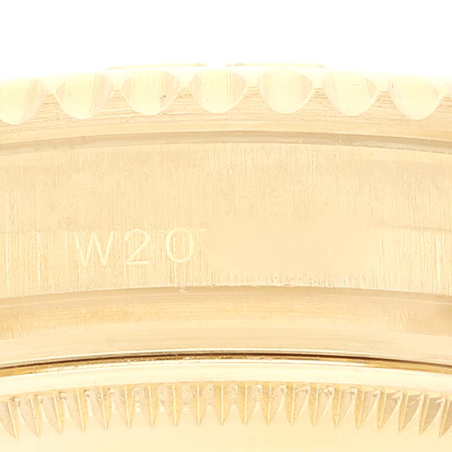 This is a close-up view of the Rolex Yacht-Master 68628 Men's Yellow Gold Mother of Pearl Dial 68628 Men's Yellow Gold Mother of Pearl Dial watch's side with its bezel and engraved model details visible.