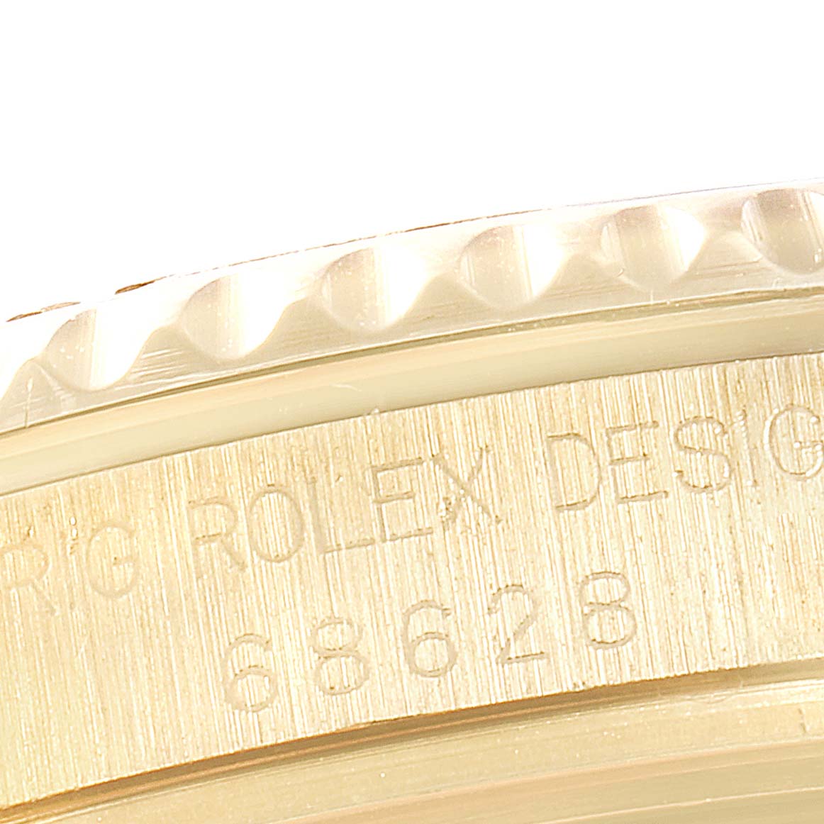 This close-up image shows the side view of the bezel and case detailing on a Rolex Yacht-Master 68628 Men's Yellow Gold Mother of Pearl Dial 68628 Men's Yellow Gold Mother of Pearl Dial watch.