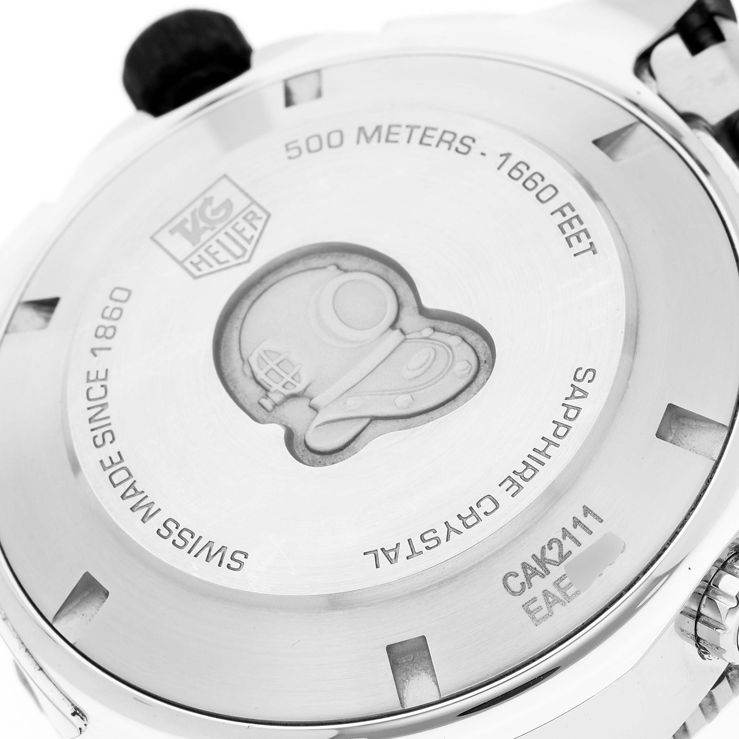 This image shows the back case of the Tag Heuer Aquaracer CAK2111.BA0833 Men's Stainless Steel Black Dial CAK2111.BA0833 Men's Stainless Steel Black Dial watch, featuring engravings and a diving helmet design.