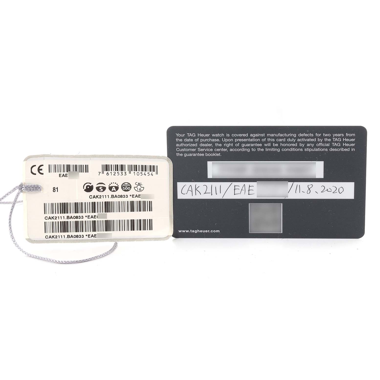 The image shows the authenticity card and tag for a Tag Heuer Aquaracer CAK2111.BA0833 Men's Stainless Steel Black Dial CAK2111.BA0833 Men's Stainless Steel Black Dial model, labeled with model and serial numbers.