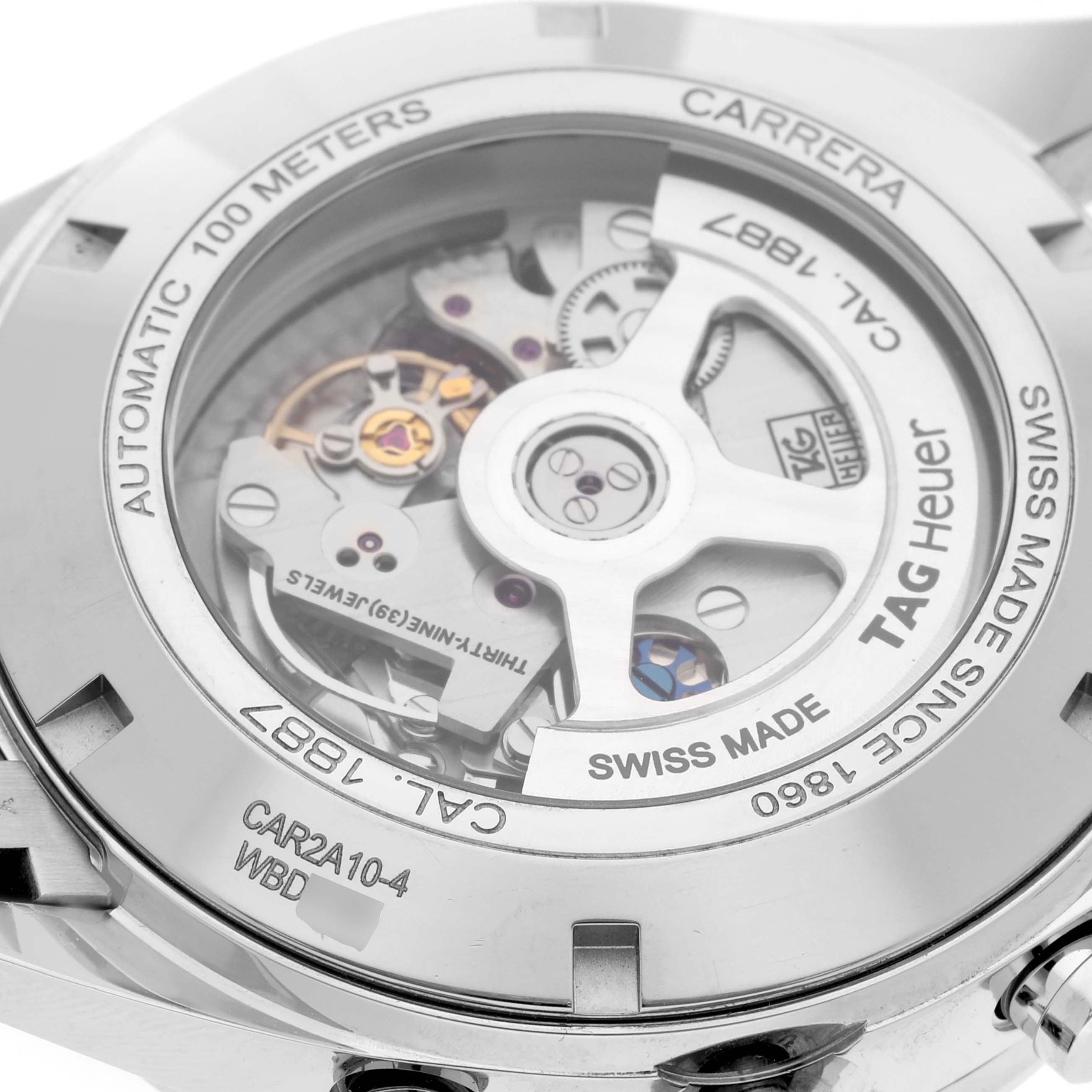 The image shows the back view of a Tag Heuer Carrera CAR2A10-2 Men's Stainless Steel Black Dial CAR2A10-2 Men's Stainless Steel Black Dial watch, revealing its automatic movement and intricate inner mechanisms.