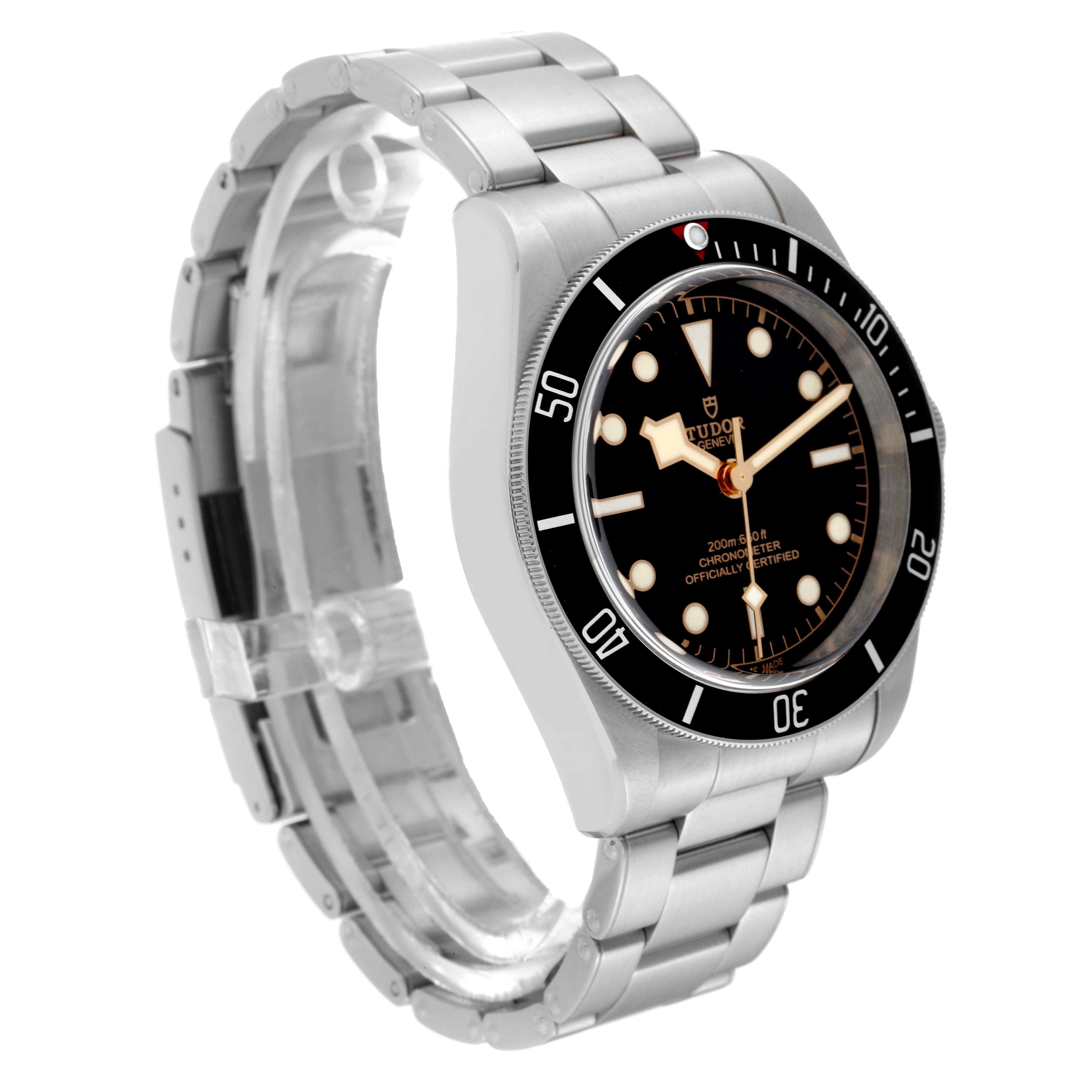 The image shows a side-angle view of the Tudor Heritage Black Bay 79230N Men
s Stainless Steel Black Dial 79230N Men
s Stainless Steel Black Dial watch, highlighting its stainless steel case and bracelet with a black dial.