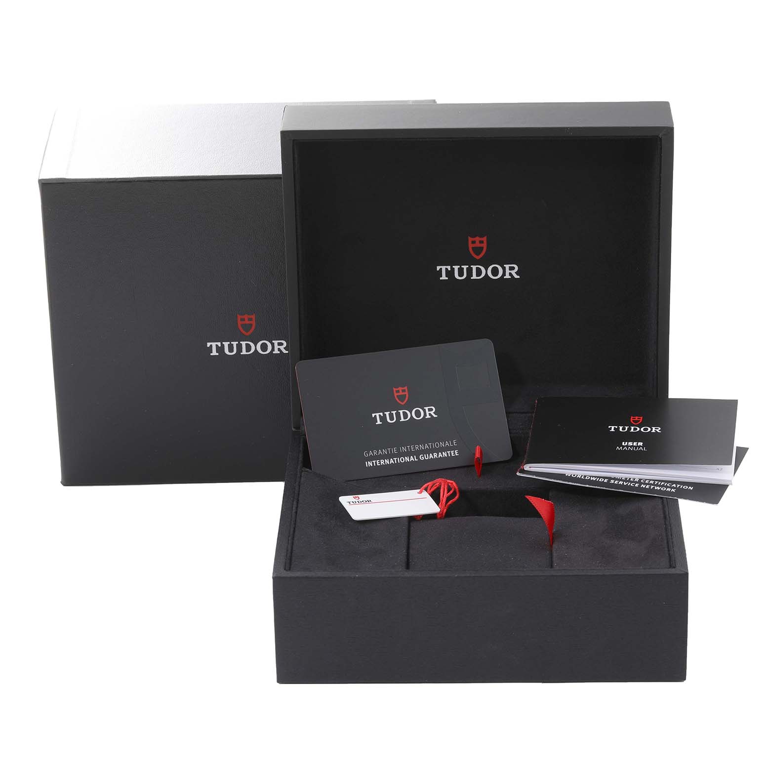 This image shows the packaging, international guarantee card, user manual, and tags for the Tudor Heritage Black Bay 79230N Men
s Stainless Steel Black Dial 79230N Men
s Stainless Steel Black Dial watch model.
