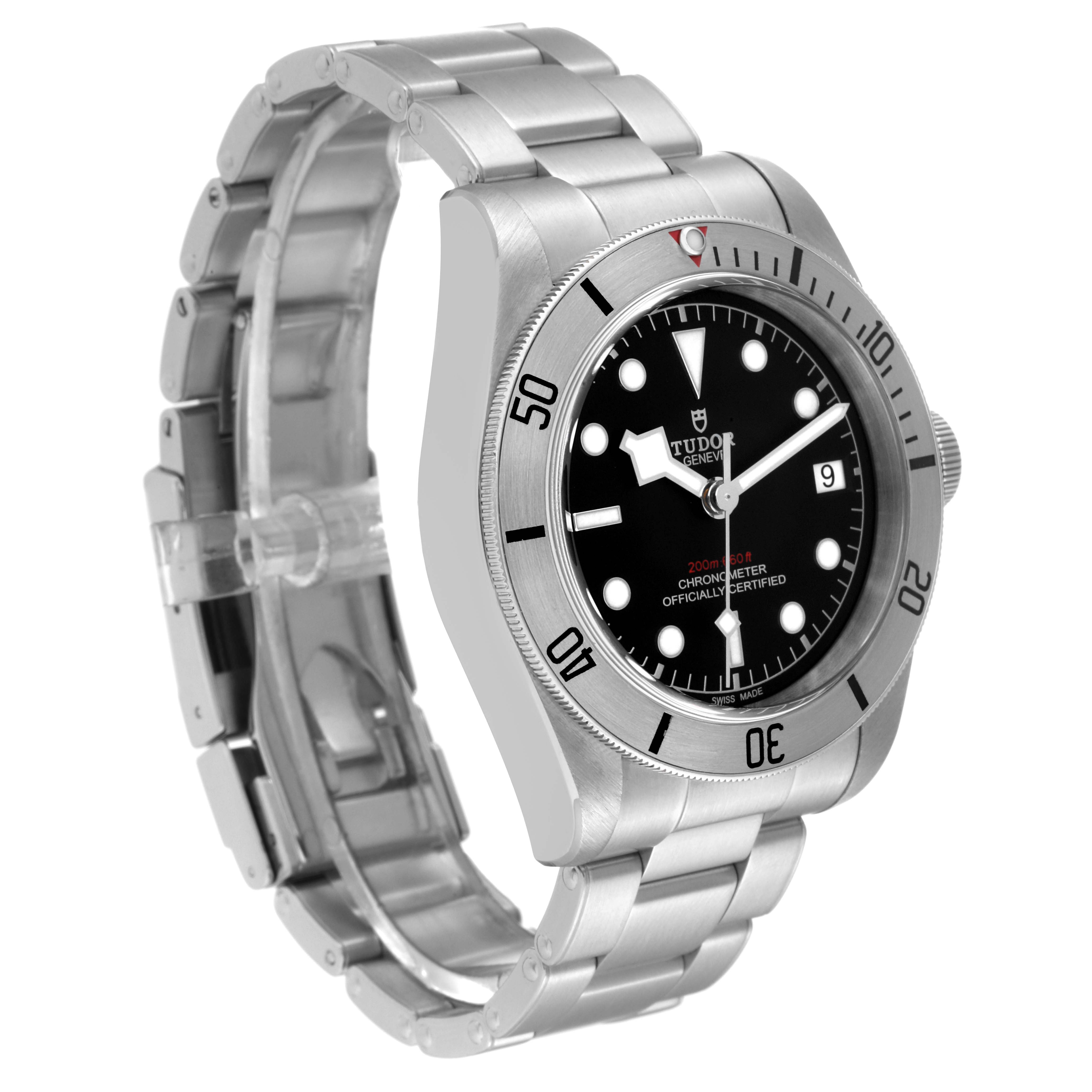 The image shows a Tudor Heritage Black Bay 79730 Men
s Stainless Steel Black Dial 79730 Men
s Stainless Steel Black Dial watch from an angled view, highlighting its dial, bezel, and metal bracelet.