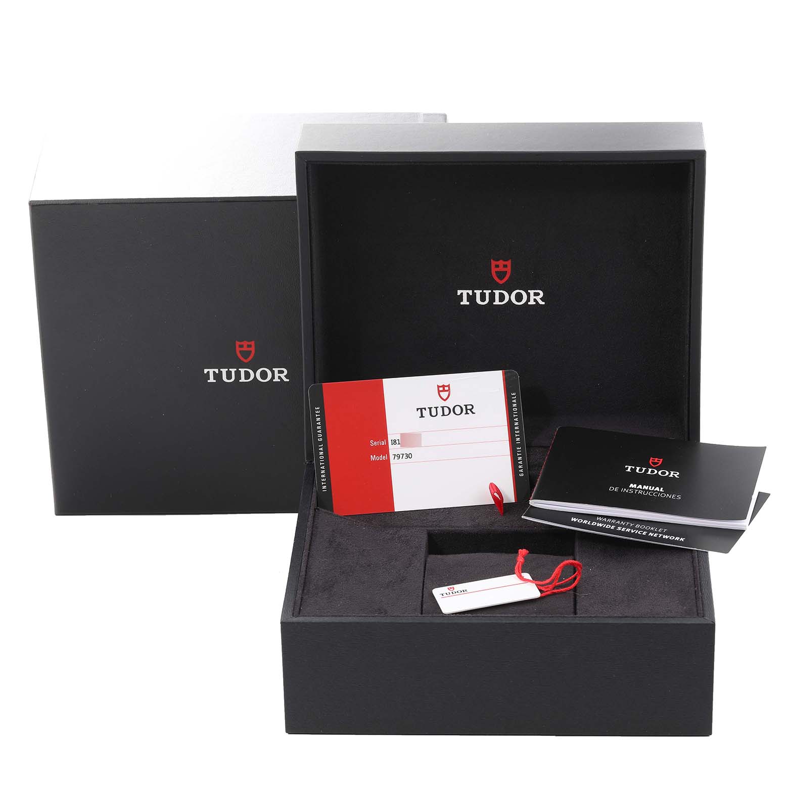 The image shows the Tudor Heritage Black Bay 79730 Men
s Stainless Steel Black Dial 79730 Men
s Stainless Steel Black Dial packaging, warranty card, tag, and instruction booklets.