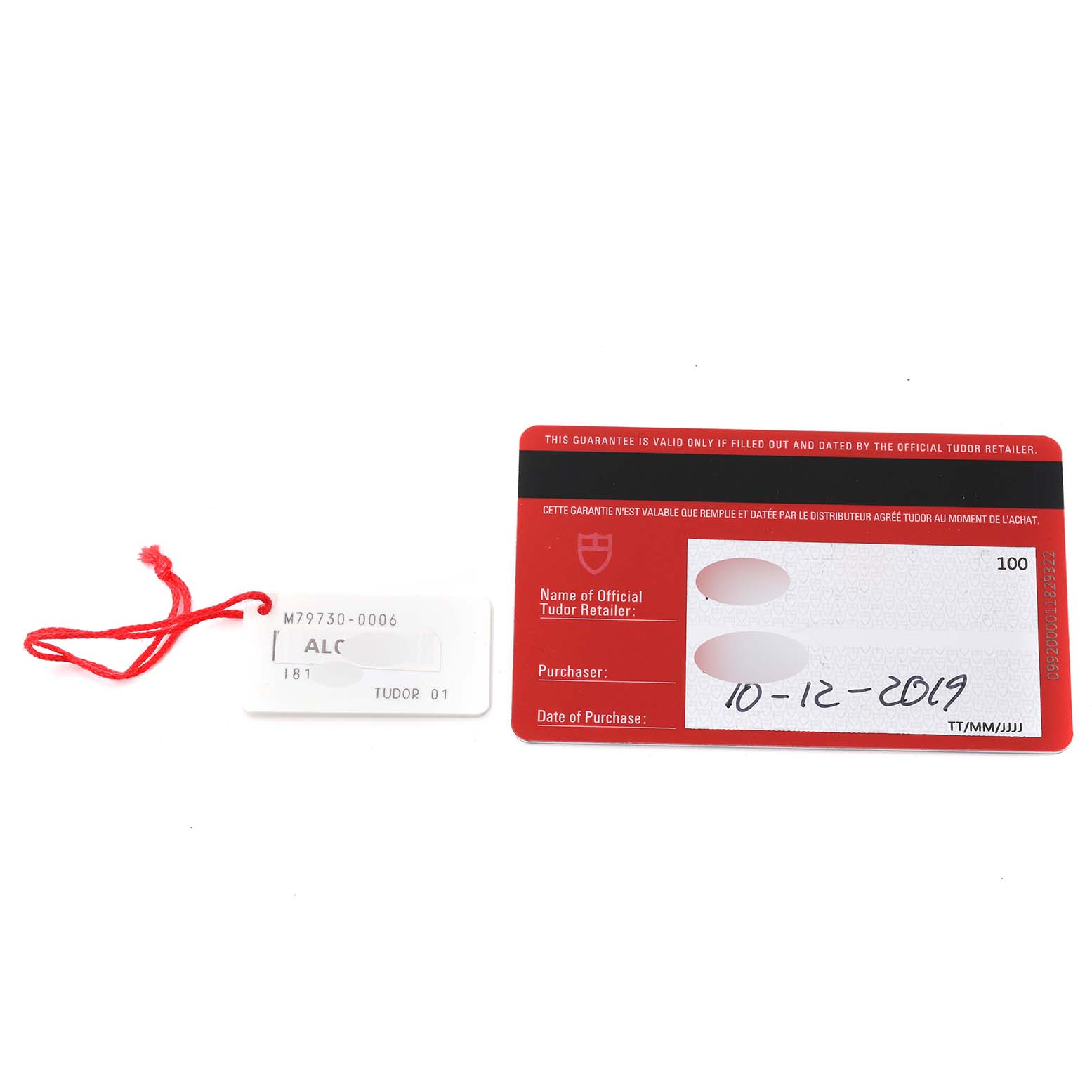 The image shows a warranty card and a tag for the Tudor Heritage Black Bay 79730 Men
s Stainless Steel Black Dial 79730 Men
s Stainless Steel Black Dial watch.