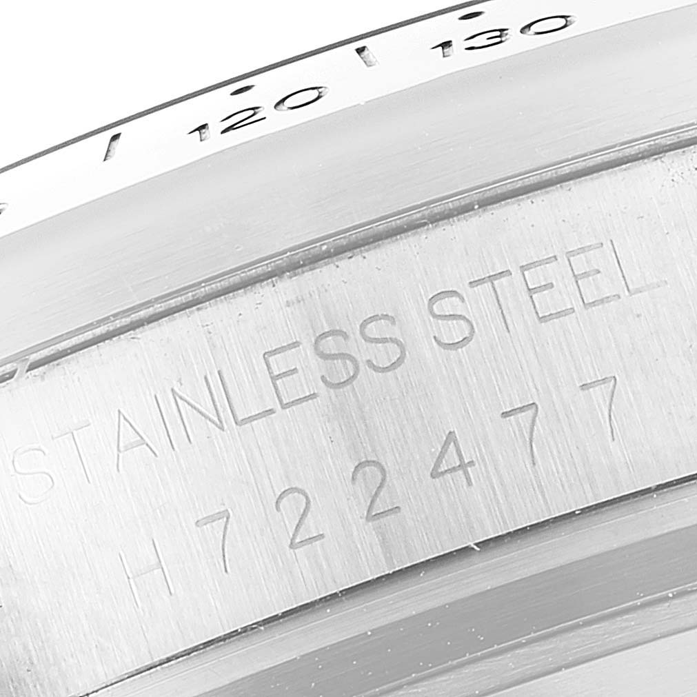 This close-up image shows the stainless steel bezel and the serial number of a Tudor Sport Chronograph 20300 Men's Stainless Steel Grey Dial 20300 Men's Stainless Steel Grey Dial watch.