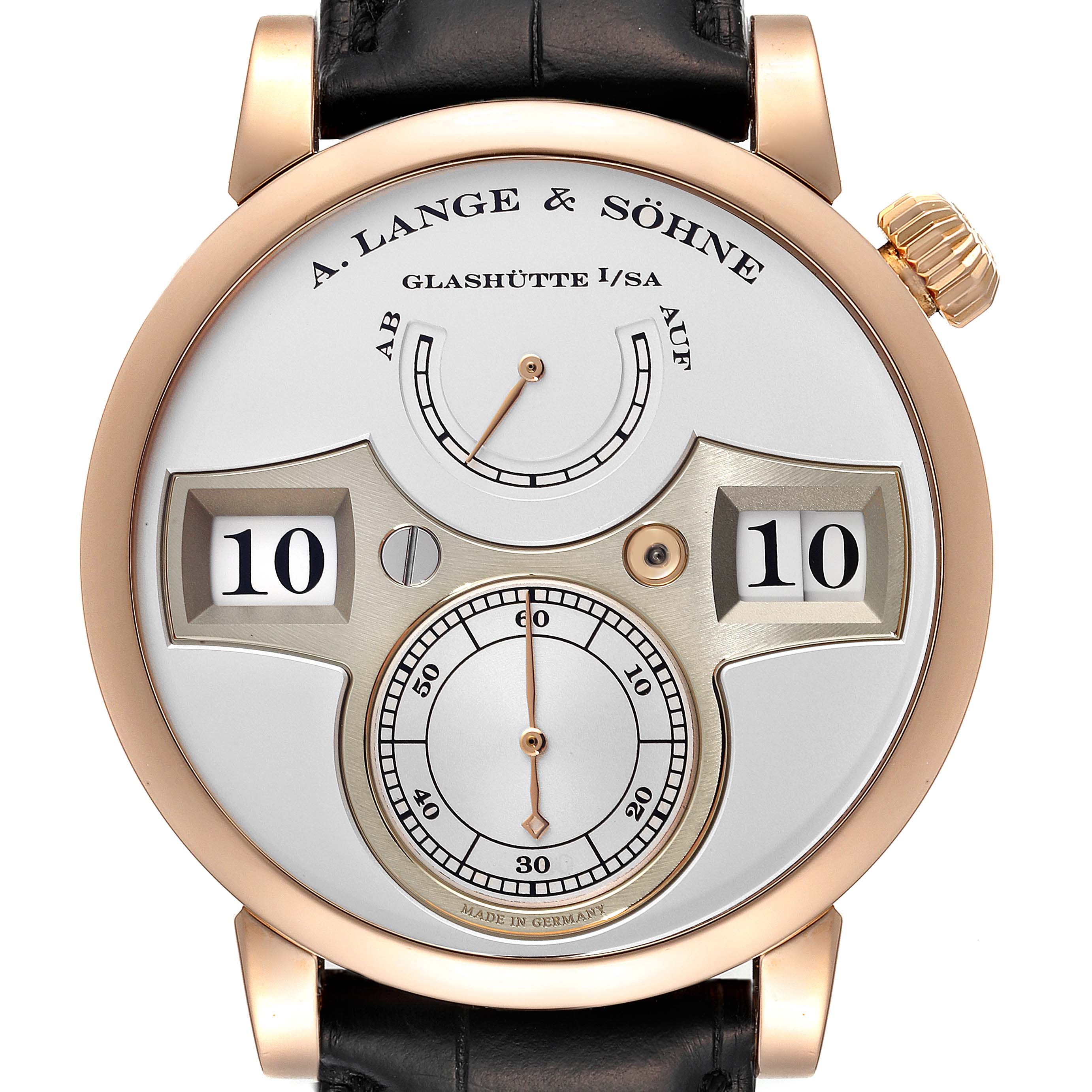 The Zeitwerk model by A. Lange & Söhne is shown from a top-down angle, displaying the face, time display, and dial indicators.