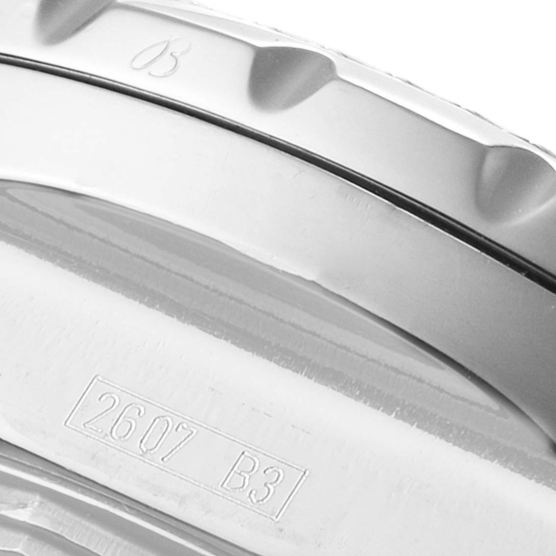 This close-up image shows the bezel and case back engraving details of a Bentley model by Breitling.