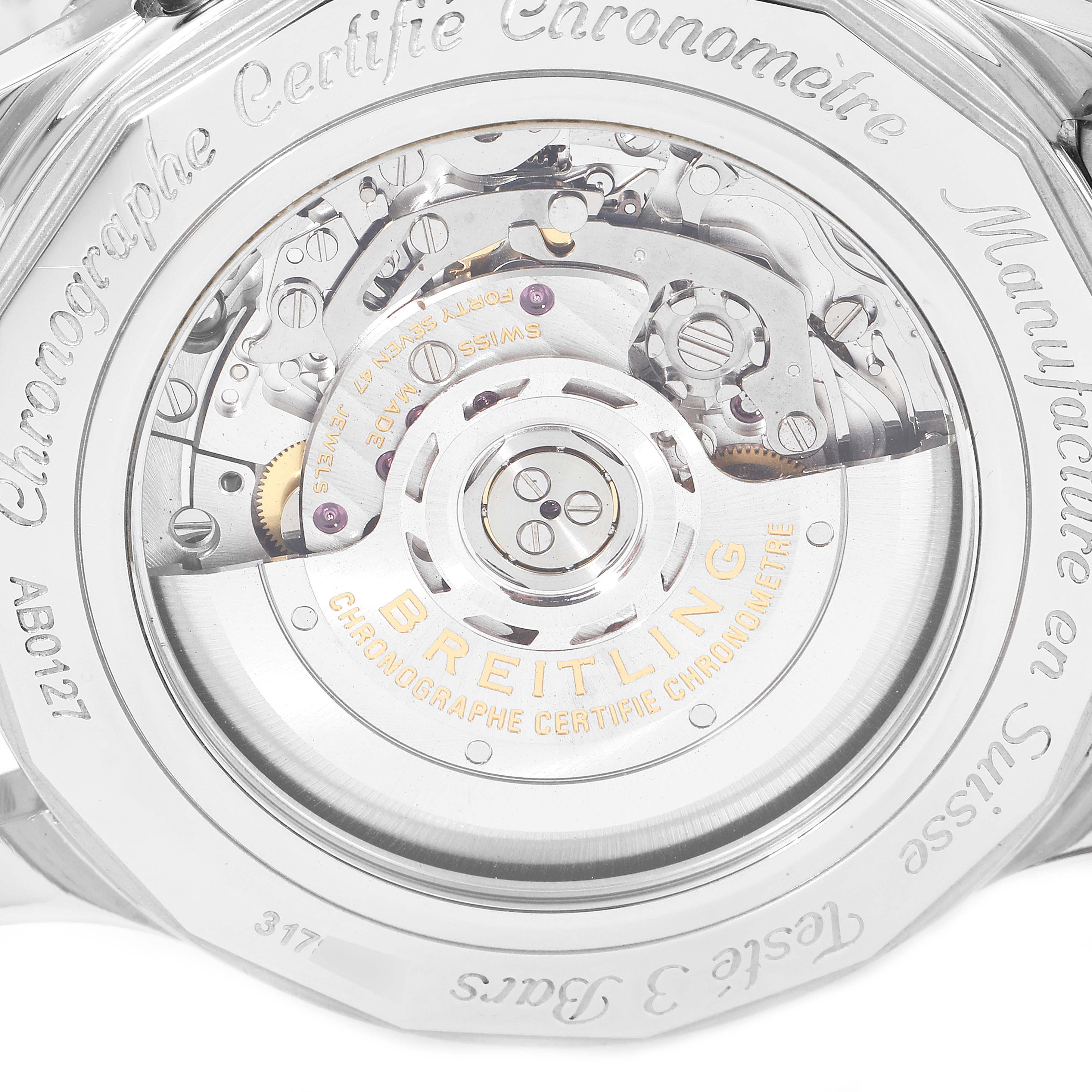 The image shows the back case of a Breitling Navitimer AB0127-211-B1A1 Men's Stainless Steel Black Dial AB0127-211-B1A1 Men's Stainless Steel Black Dial, highlighting its intricate mechanical movement.