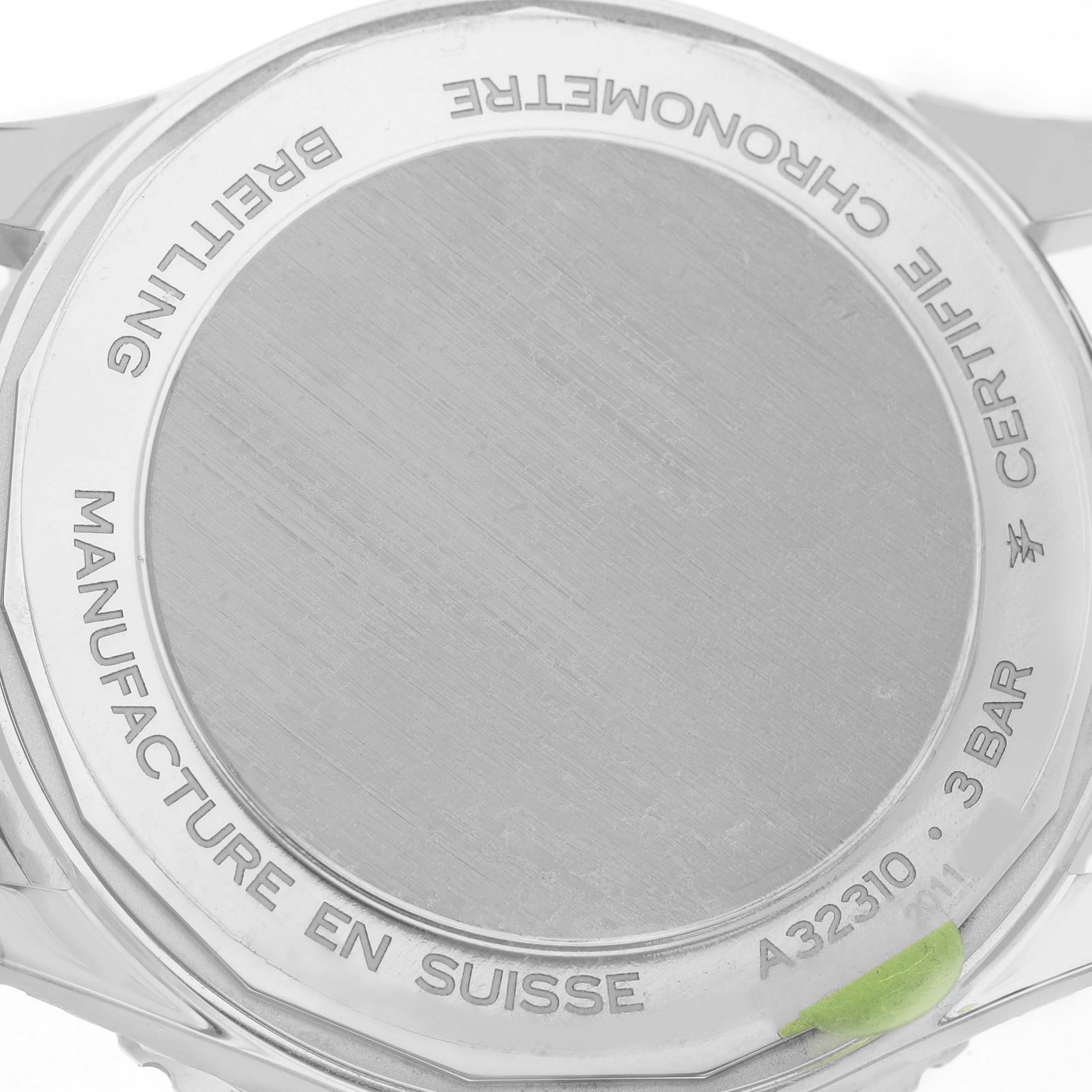 The image shows the case back of a Breitling Navitimer A32310 Men's Stainless Steel Silver Dial watch, displaying engravings and model details.