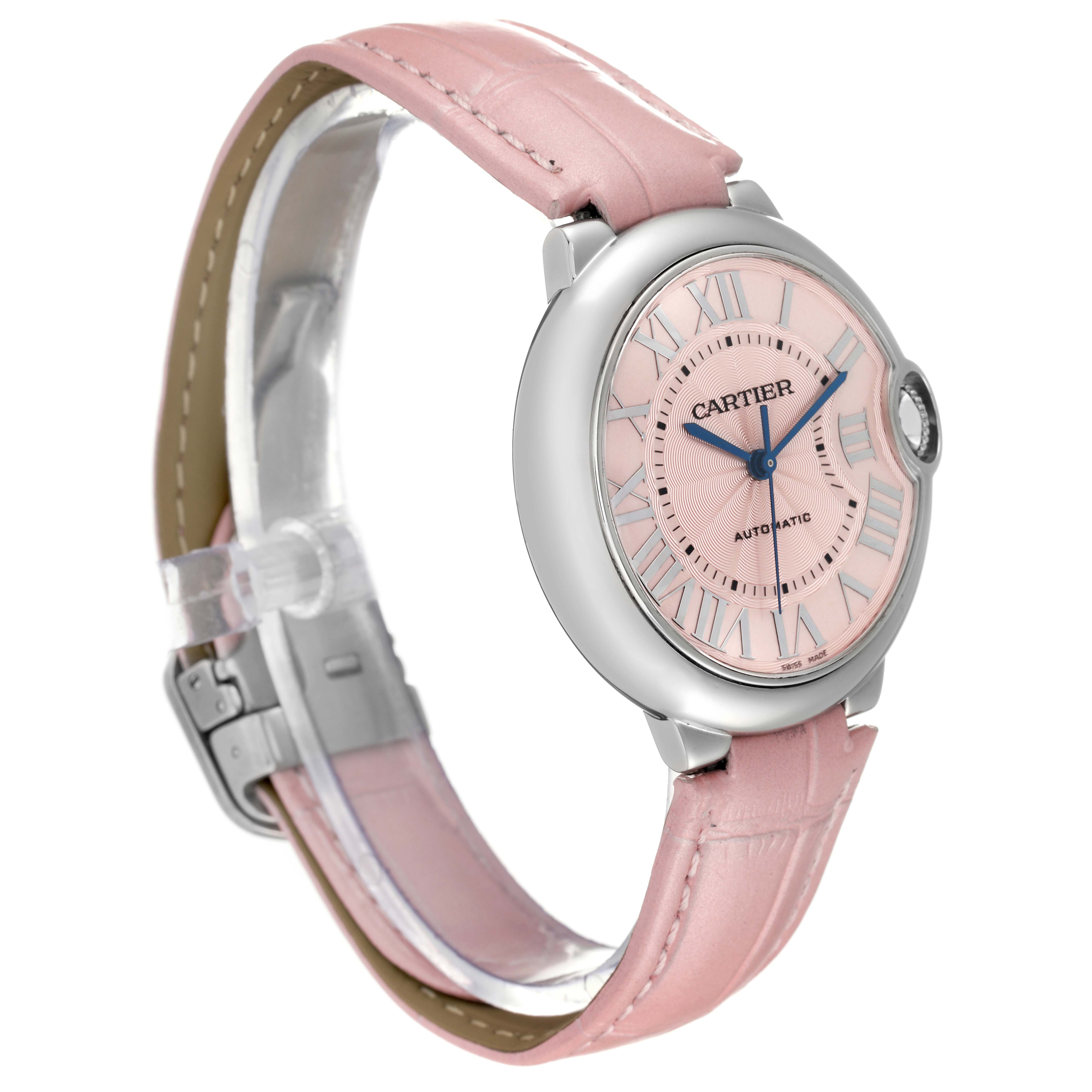 The Cartier Ballon Bleu WSBB0007 Women
s Stainless Steel Pink Dial WSBB0007 Women
s Stainless Steel Pink Dial watch is shown at a three-quarter angle, displaying its pink dial, silver case, blue hands, and pink leather strap.