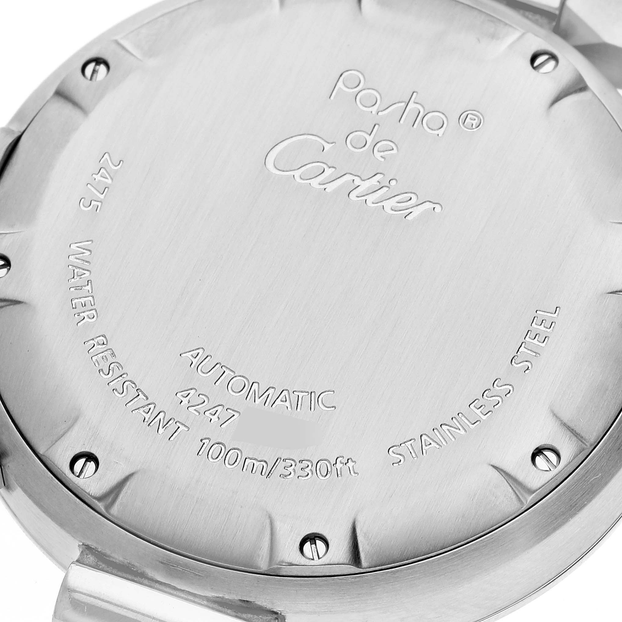 The image shows the back case of a Cartier Pasha W31044M7 Men's Stainless Steel White Dial W31044M7 Men's Stainless Steel White Dial watch, displaying inscriptions about its specifications and brand.