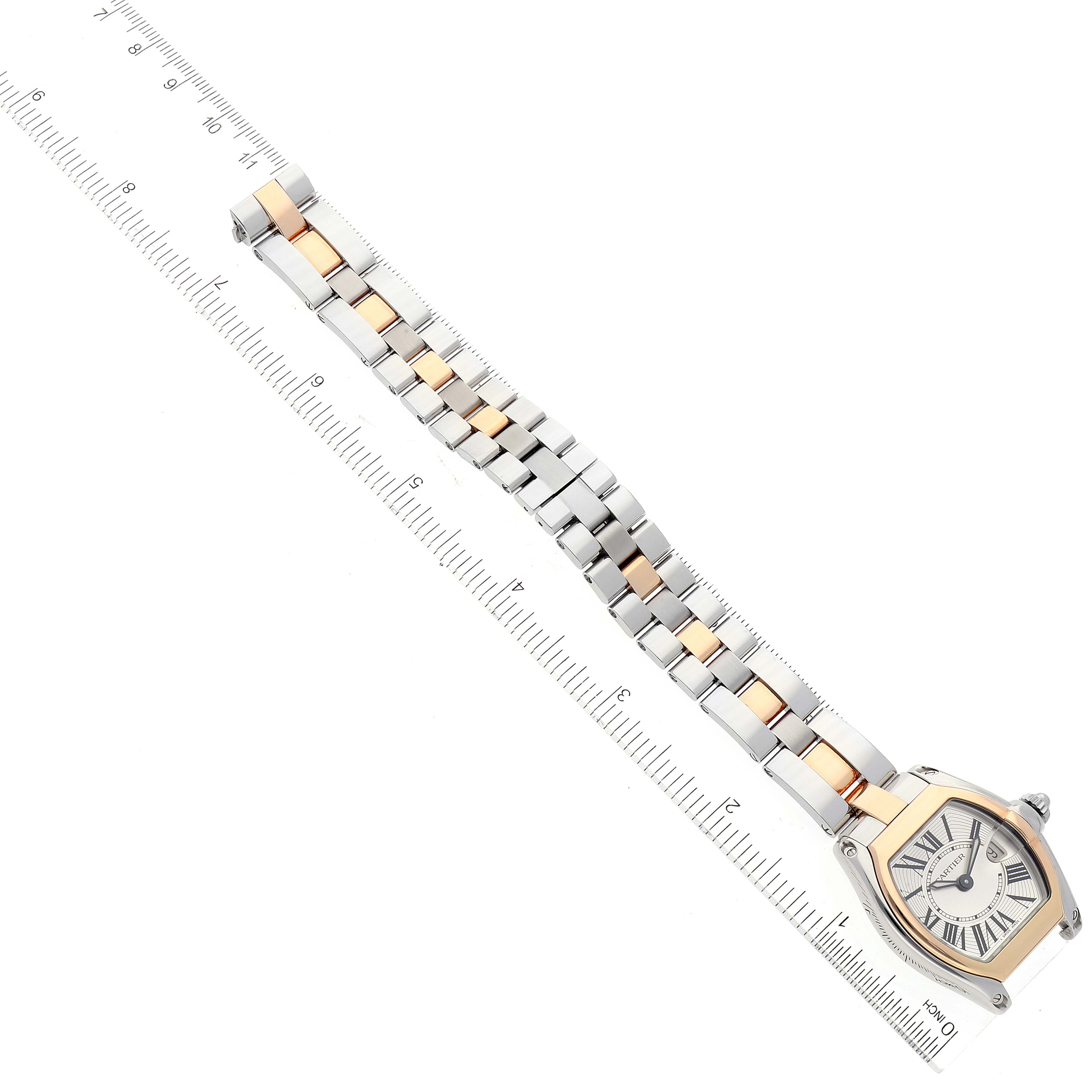 The image shows a top-down view of the Cartier Roadster W62026Y4 Women's Steel and Gold (two tone) Silver Dial W62026Y4 Women's Steel and Gold (two tone) Silver Dial watch, including the bracelet laid next to a ruler for measurement.