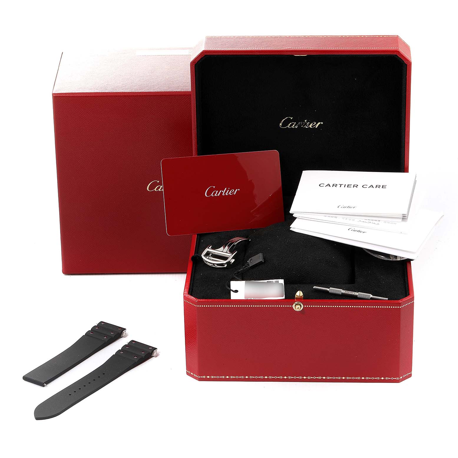 The image shows a Cartier Santos WSSA0018 Men's Stainless Steel Silver Dial WSSA0018 Men's Stainless Steel Silver Dial watch box at an angle, displaying accessory components, documentation, and extra straps.