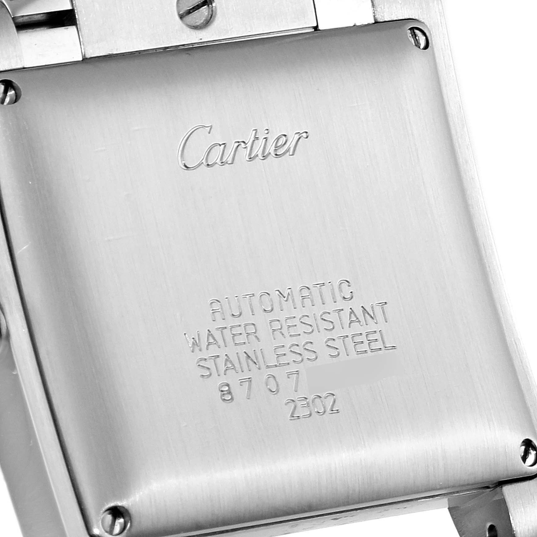 The image shows the back case of a Cartier Tank Francaise W51002Q3 Men's Stainless Steel Silver Dial W51002Q3 Men's Stainless Steel Silver Dial watch, featuring engraved details and the brand name.