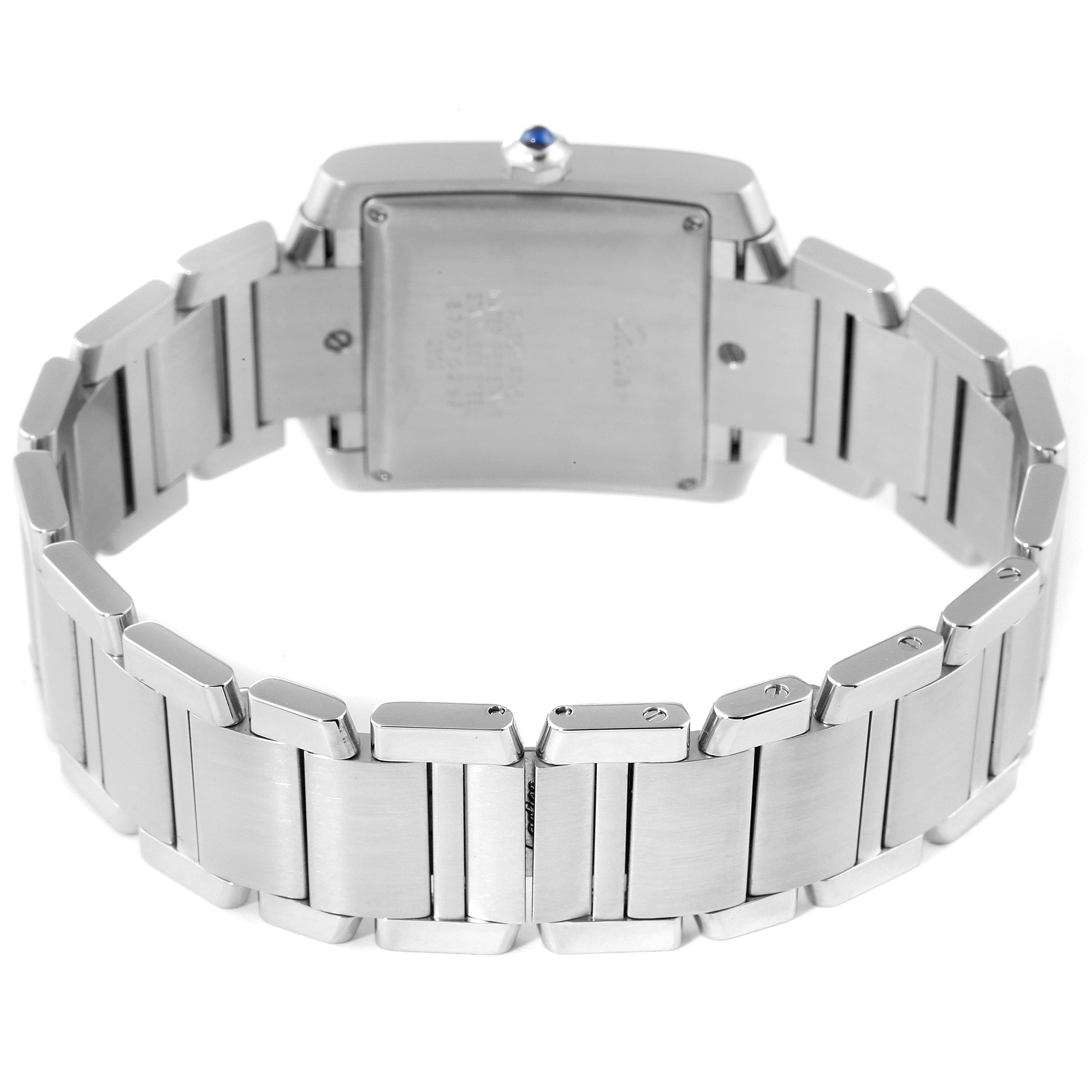 The image shows the back view of a Cartier Tank Francaise W51002Q3 Men's Stainless Steel Silver Dial W51002Q3 Men's Stainless Steel Silver Dial watch, focusing on the case back and stainless steel bracelet.