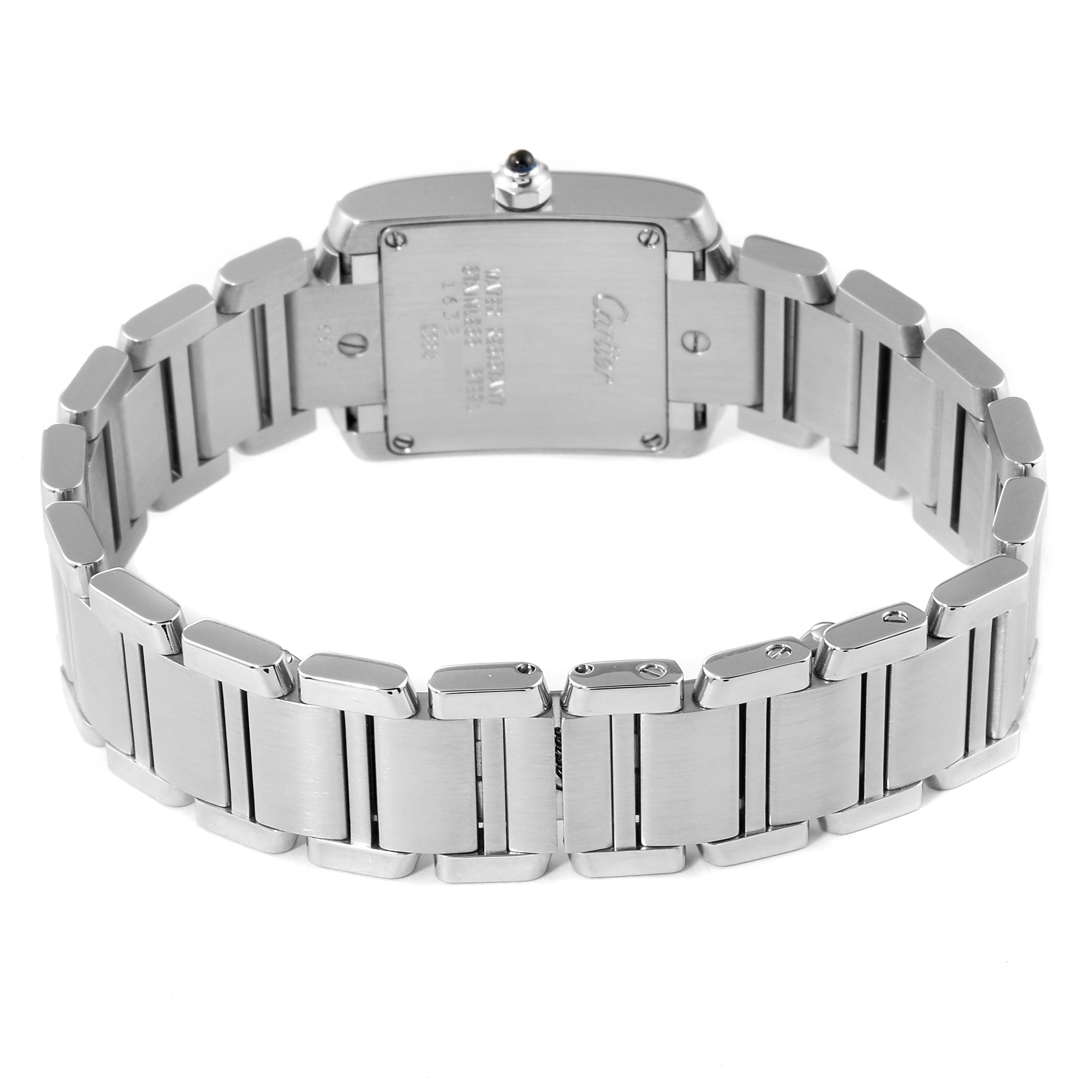 The image shows the back view of a Cartier Tank Française watch, highlighting its stainless steel bracelet and case.