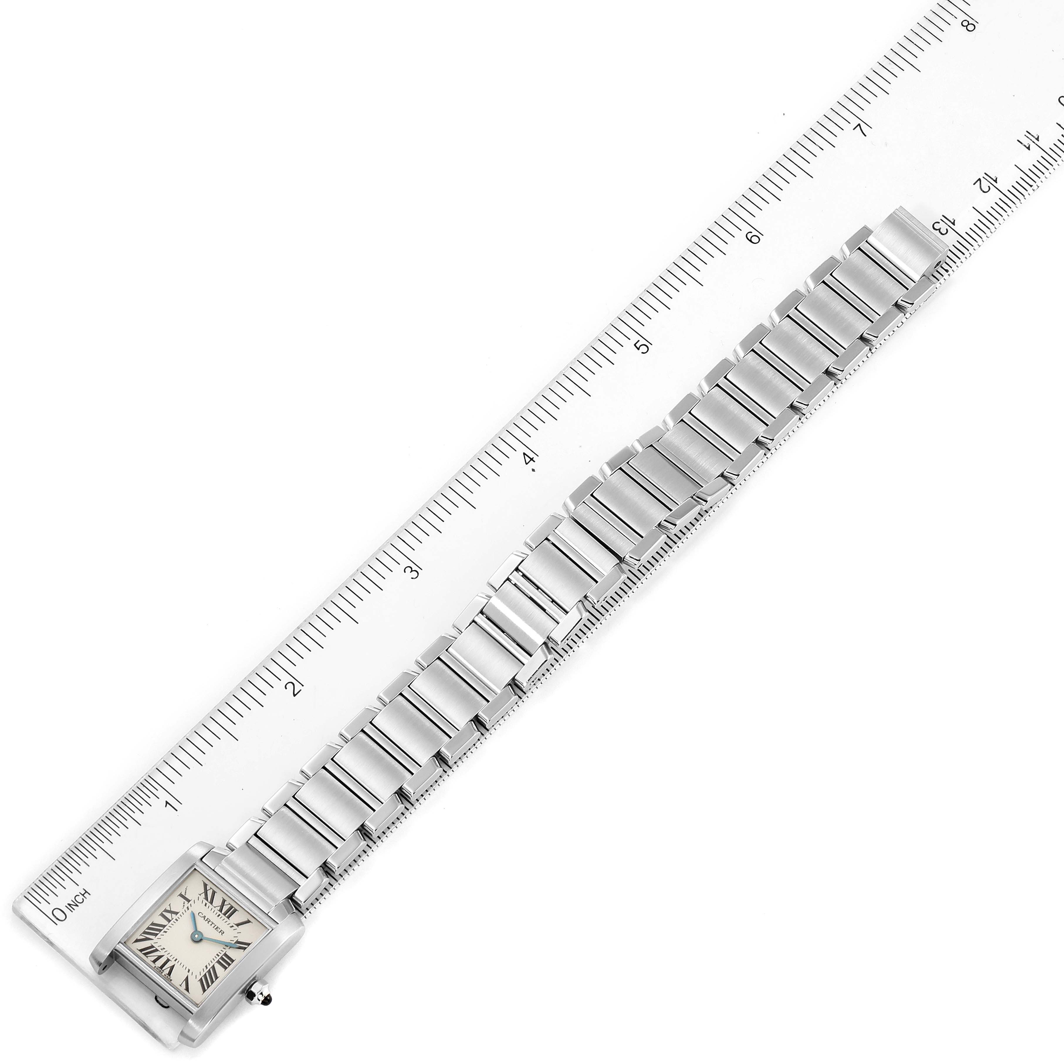 The image shows the Tank Francaise watch by Cartier from an aerial view, displaying the full bracelet and the watch face.