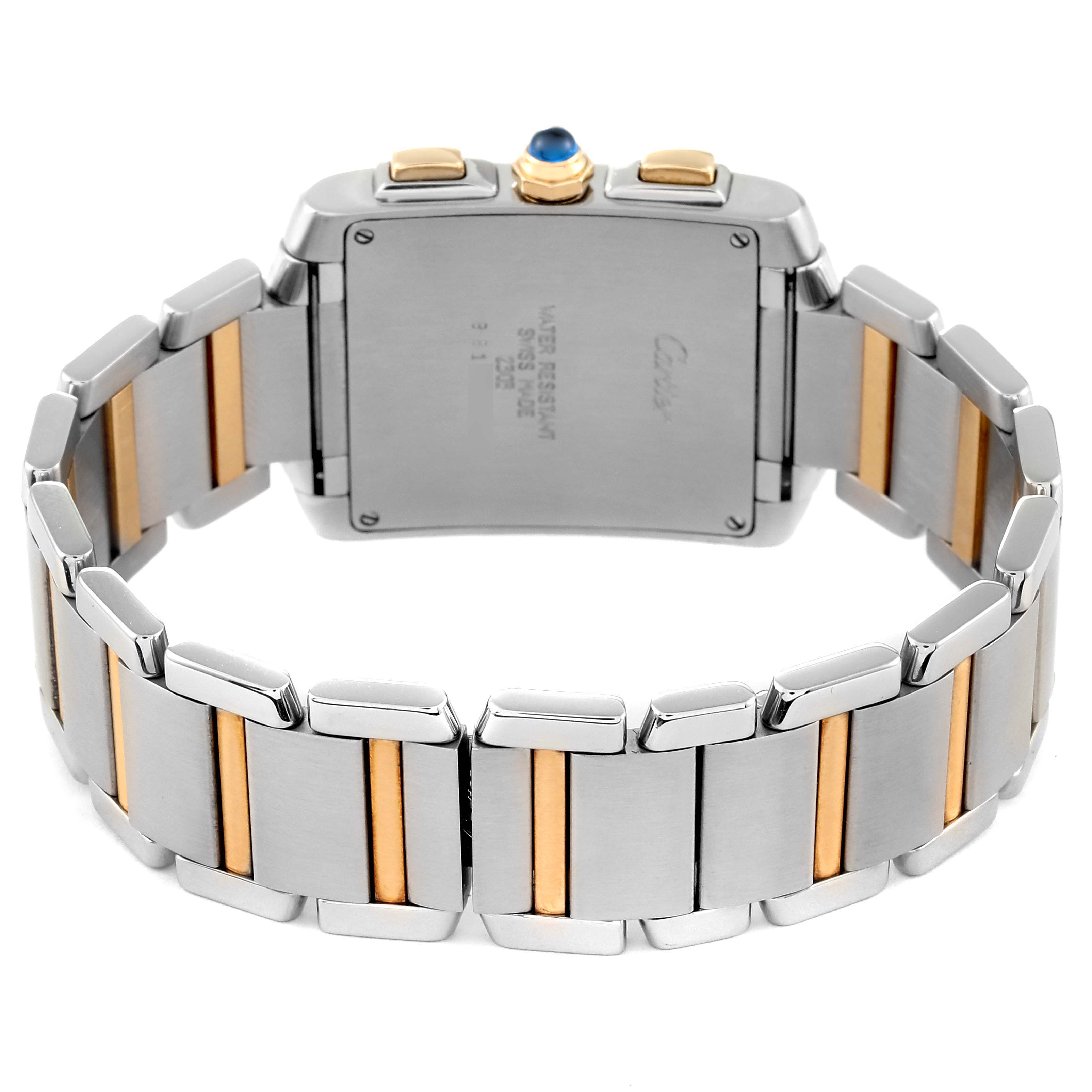 The image shows the back view of a Cartier Tank Française watch, highlighting the bracelet with its two-tone metal links and the case back.