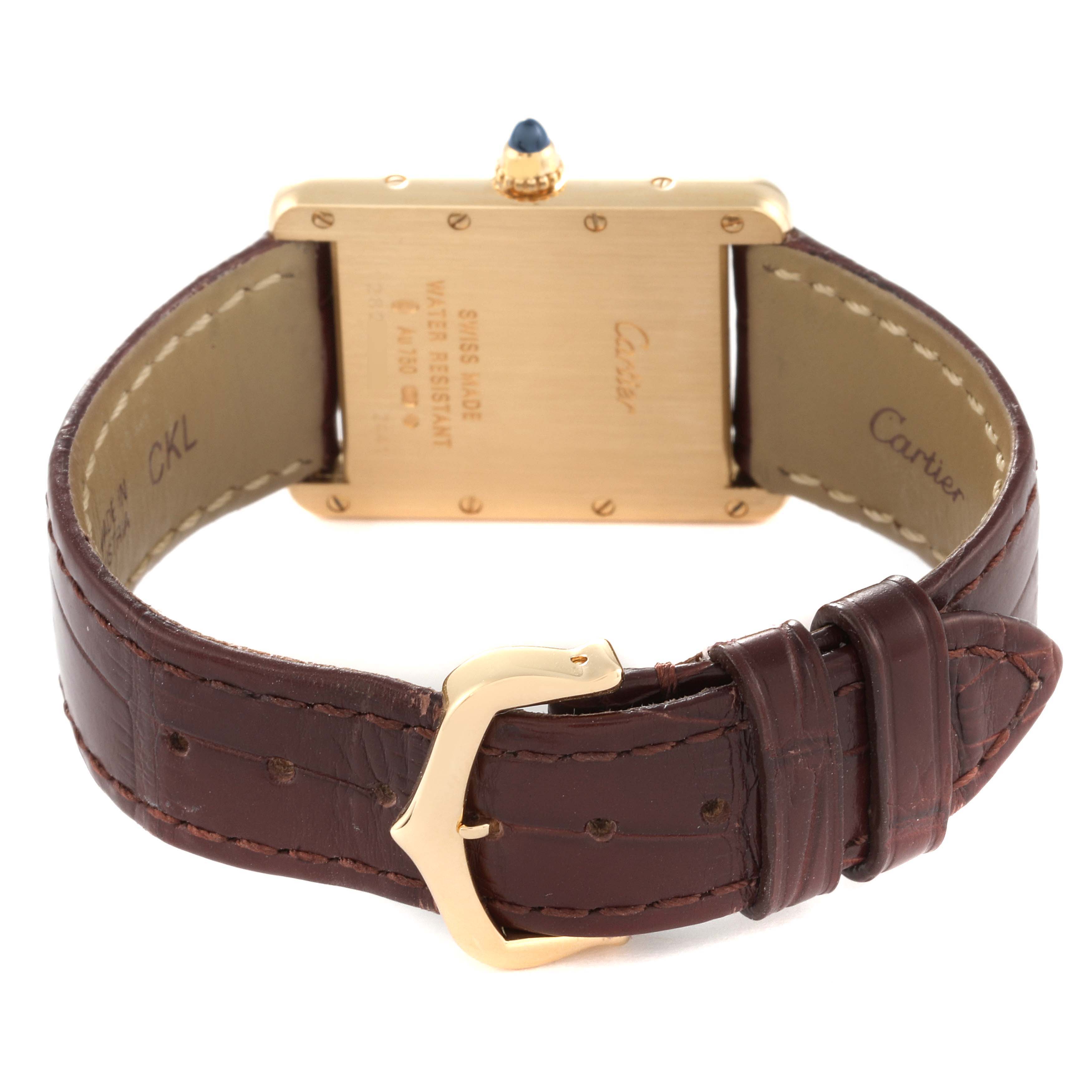 This image shows the back case, crown, and strap of a Cartier Tank Louis W1529756 Men
s Yellow Gold Silver Dial W1529756 Men
s Yellow Gold Silver Dial watch.