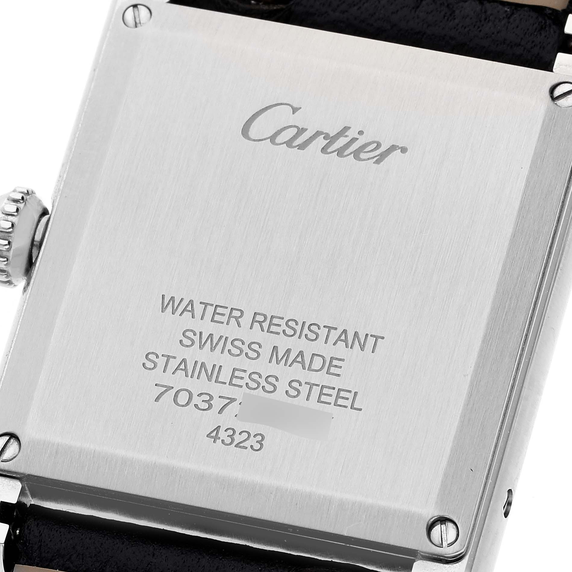 The image shows the back of a Cartier Tank Must WSTA0041 Women's Stainless Steel Silver Dial WSTA0041 Women's Stainless Steel Silver Dial watch, displaying details like water resistance, Swiss-made, stainless steel, and model numbers.