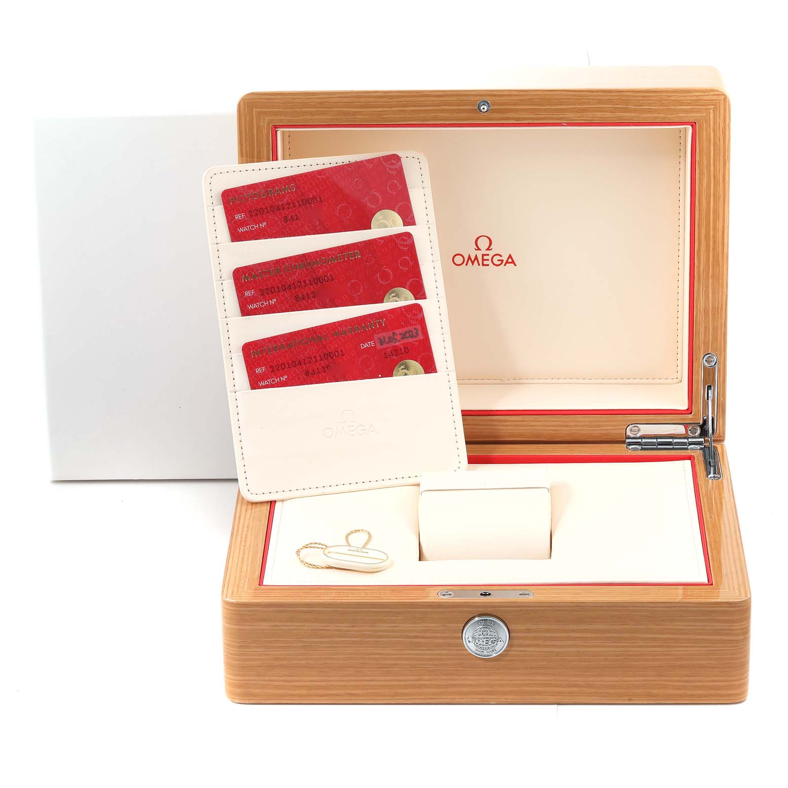 This image shows an Omega Aqua Terra 220.10.41.21.10.001 Men's Stainless Steel Green Dial 220.10.41.21.10.001 Men's Stainless Steel Green Dial watch box with warranty cards and watch accessories.