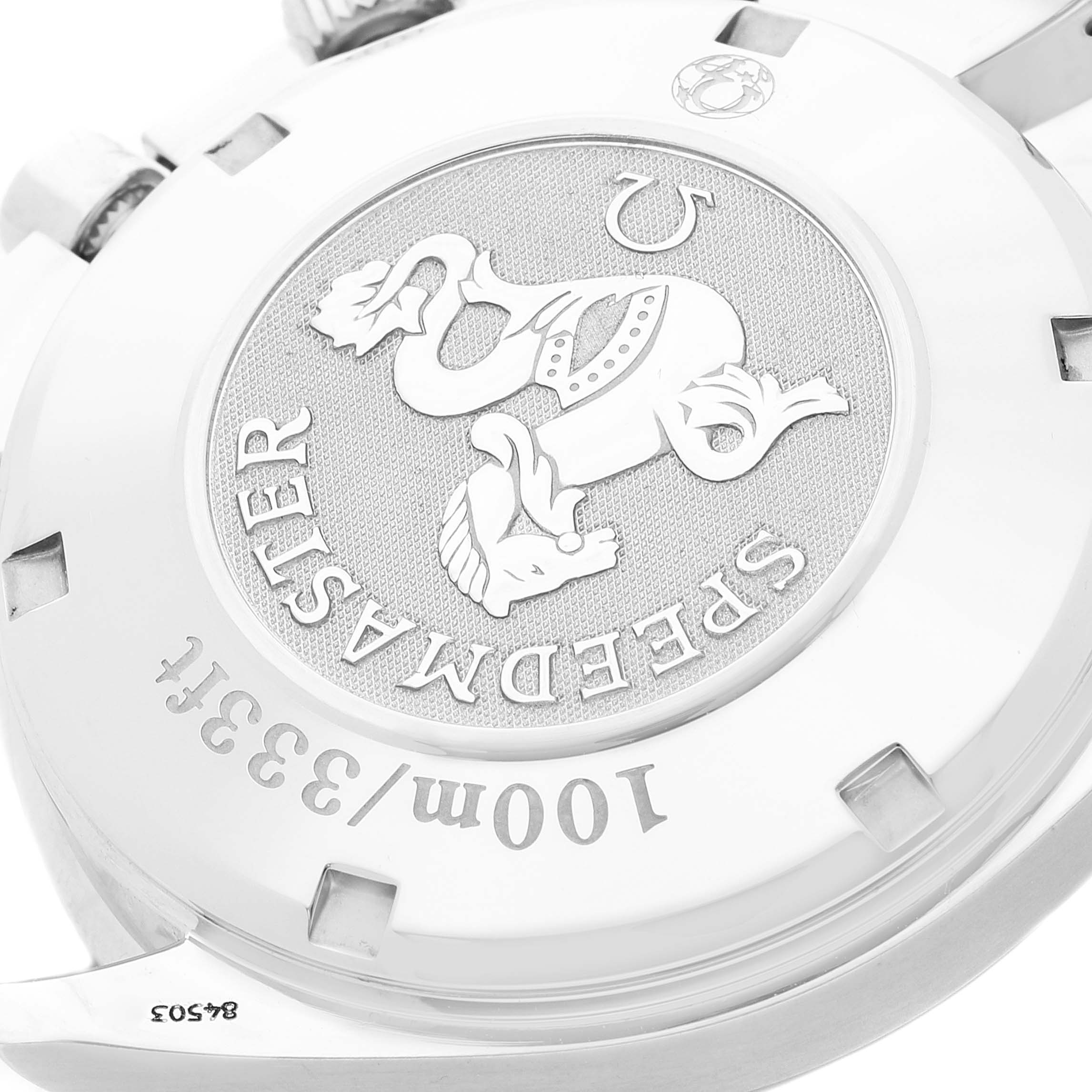 This is an angled view of the back case of the Omega Speedmaster 3210.50.00 Men
s Stainless Steel Black Dial 3210.50.00 Men
s Stainless Steel Black Dial watch, showcasing its engravings and emblem.