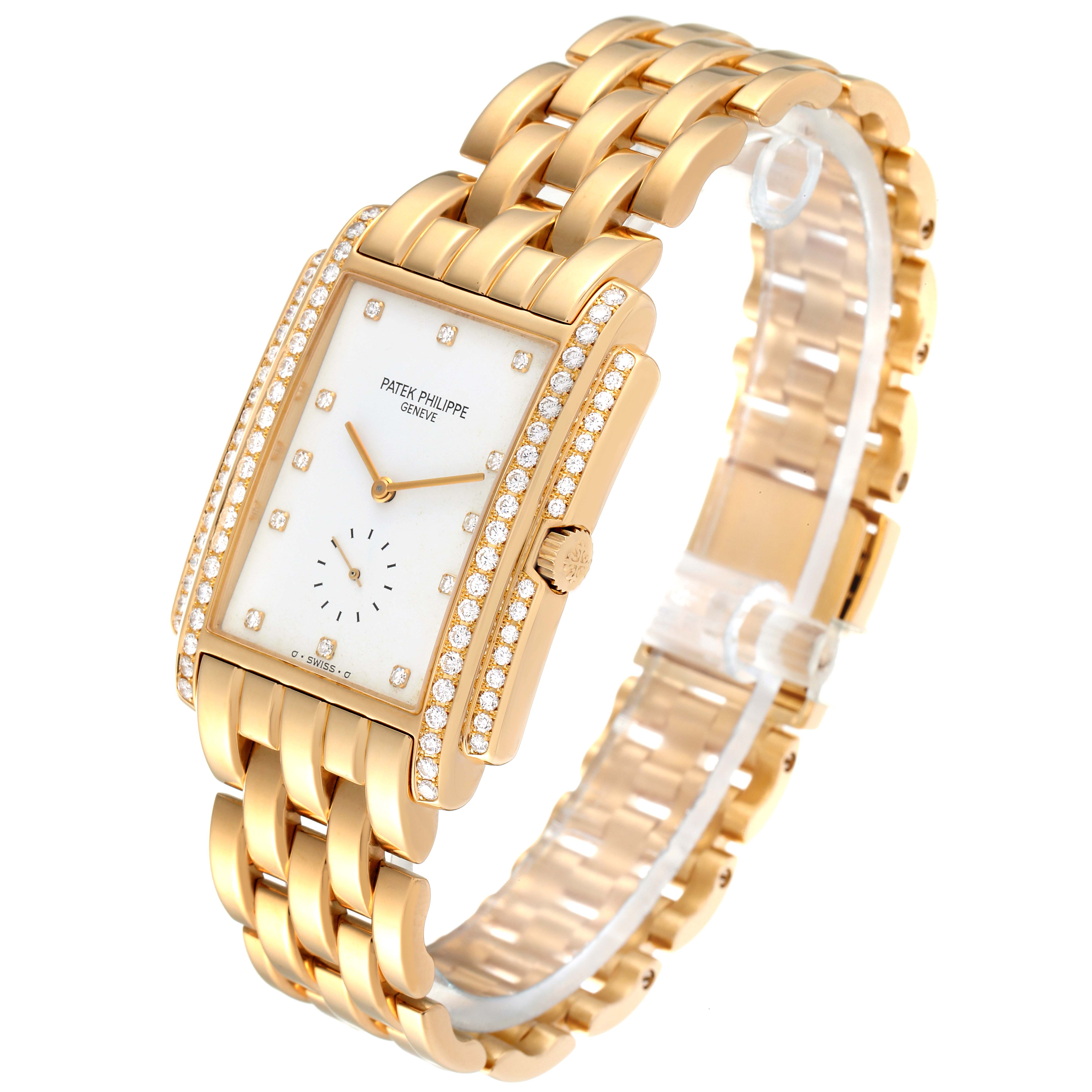 The Patek Philippe Gondolo 5025/1J Men's Yellow Gold White Dial 5025/1J Men's Yellow Gold White Dial watch is shown at an angle displaying its gold bracelet, diamond-encrusted bezel, and rectangular face.