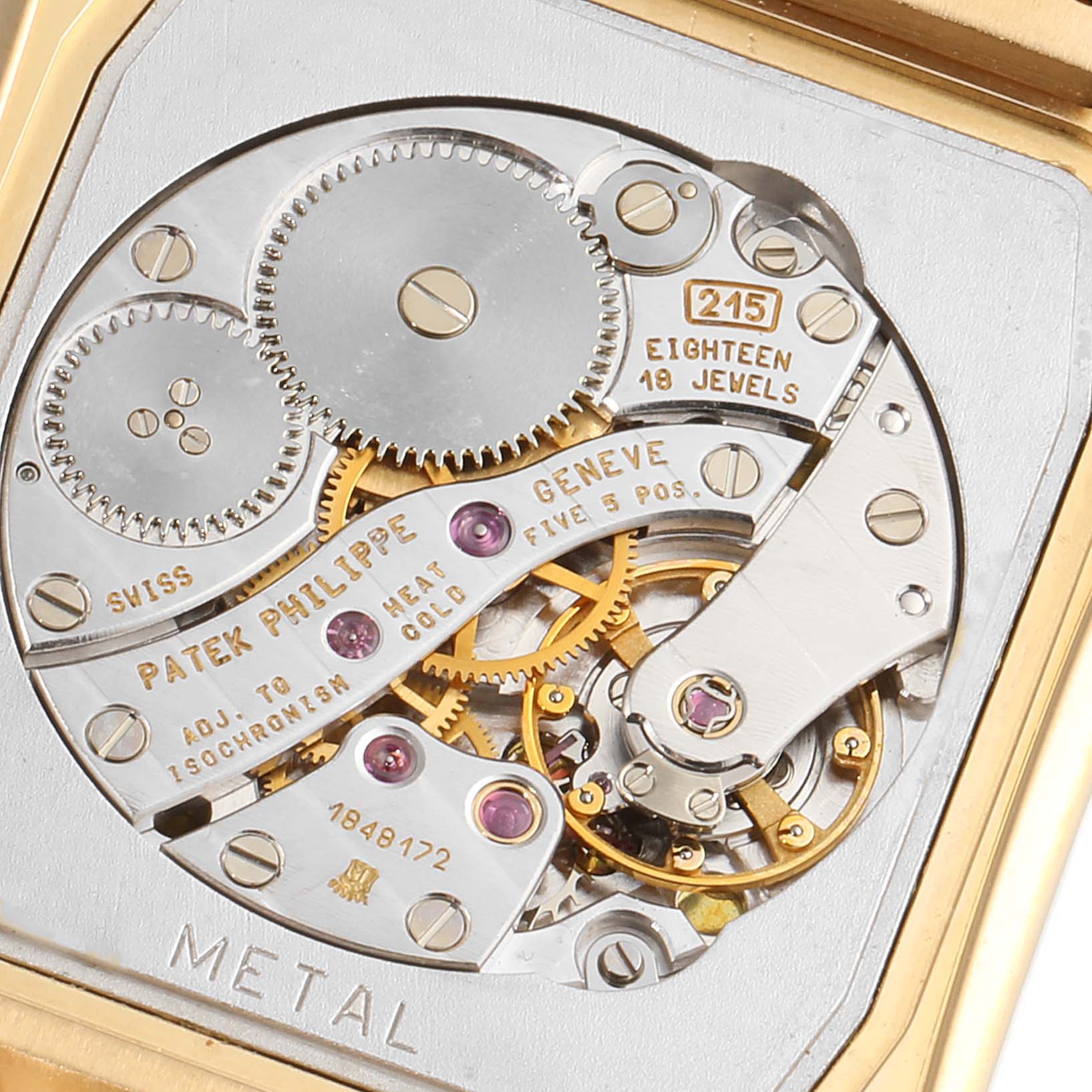 This image shows a close-up of the mechanical movement inside a Patek Philippe Gondolo 5025/1J Men's Yellow Gold White Dial 5025/1J Men's Yellow Gold White Dial watch, highlighting gears and jewels.