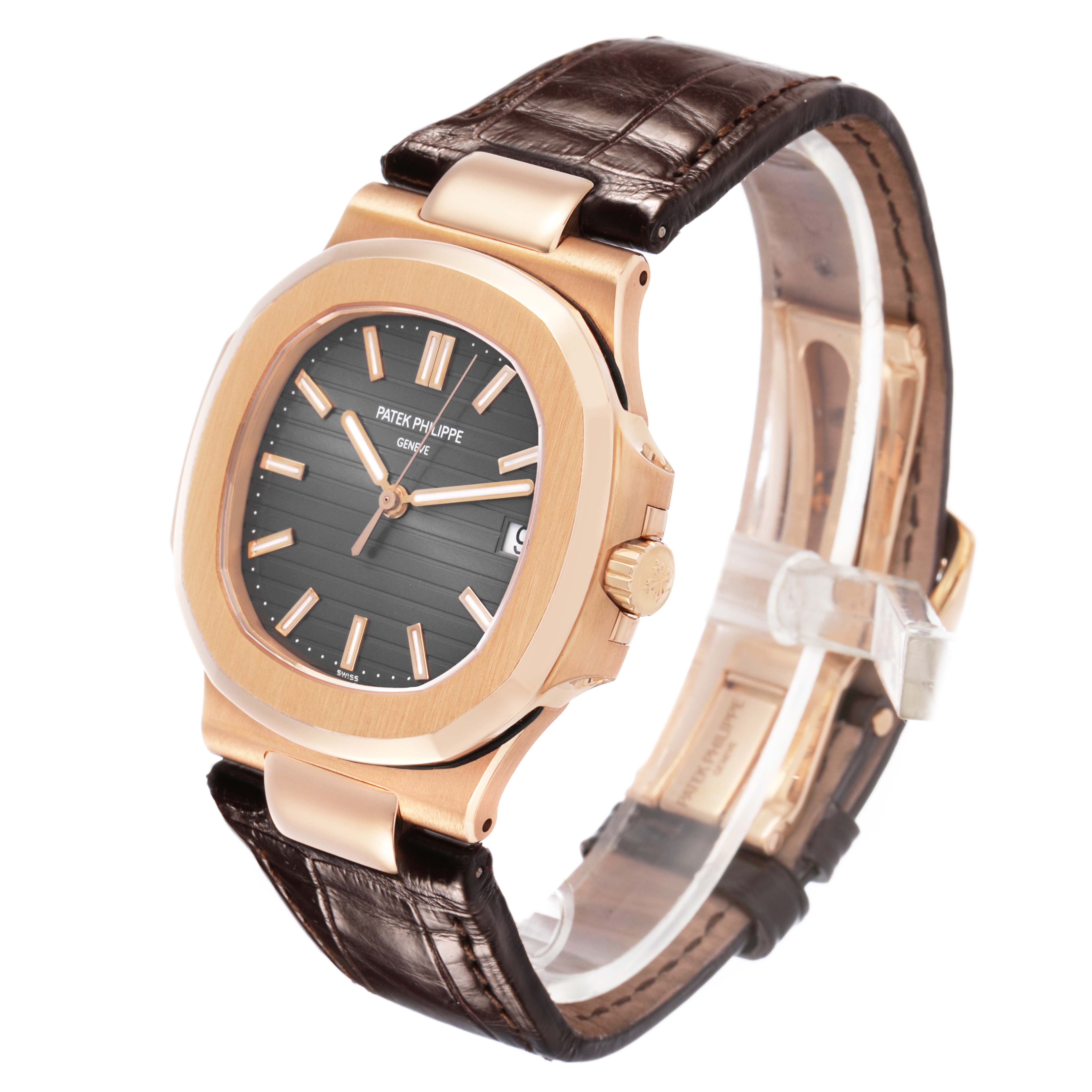 The Patek Philippe Nautilus 5711R-001 Men's Rose Gold Grey Dial watch is shown at a three-quarter angle, highlighting the dial, case, crown, and leather strap.