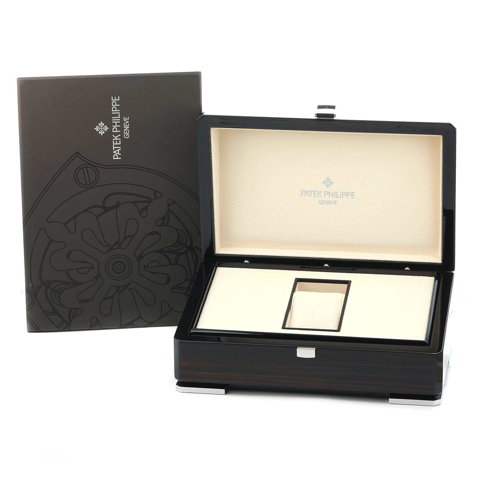 The image shows a Patek Philippe Nautilus 5711R-001 Men's Rose Gold Grey Dial watch box from a front angle, with its lid open, alongside its outer packaging.