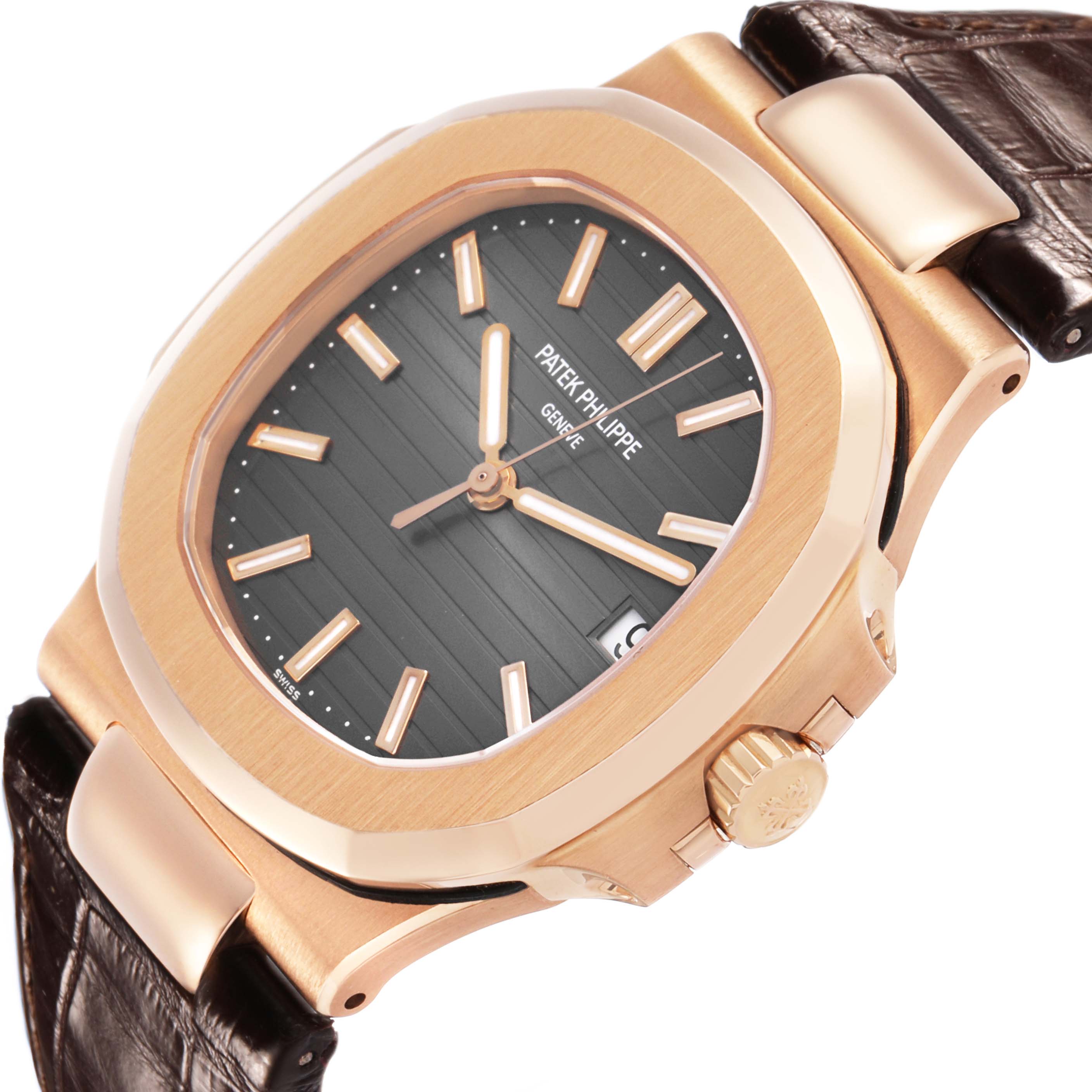The Patek Philippe Nautilus 5711R-001 Men's Rose Gold Grey Dial watch is shown at a tilted angle, highlighting the crown, bezel, and a portion of the strap.