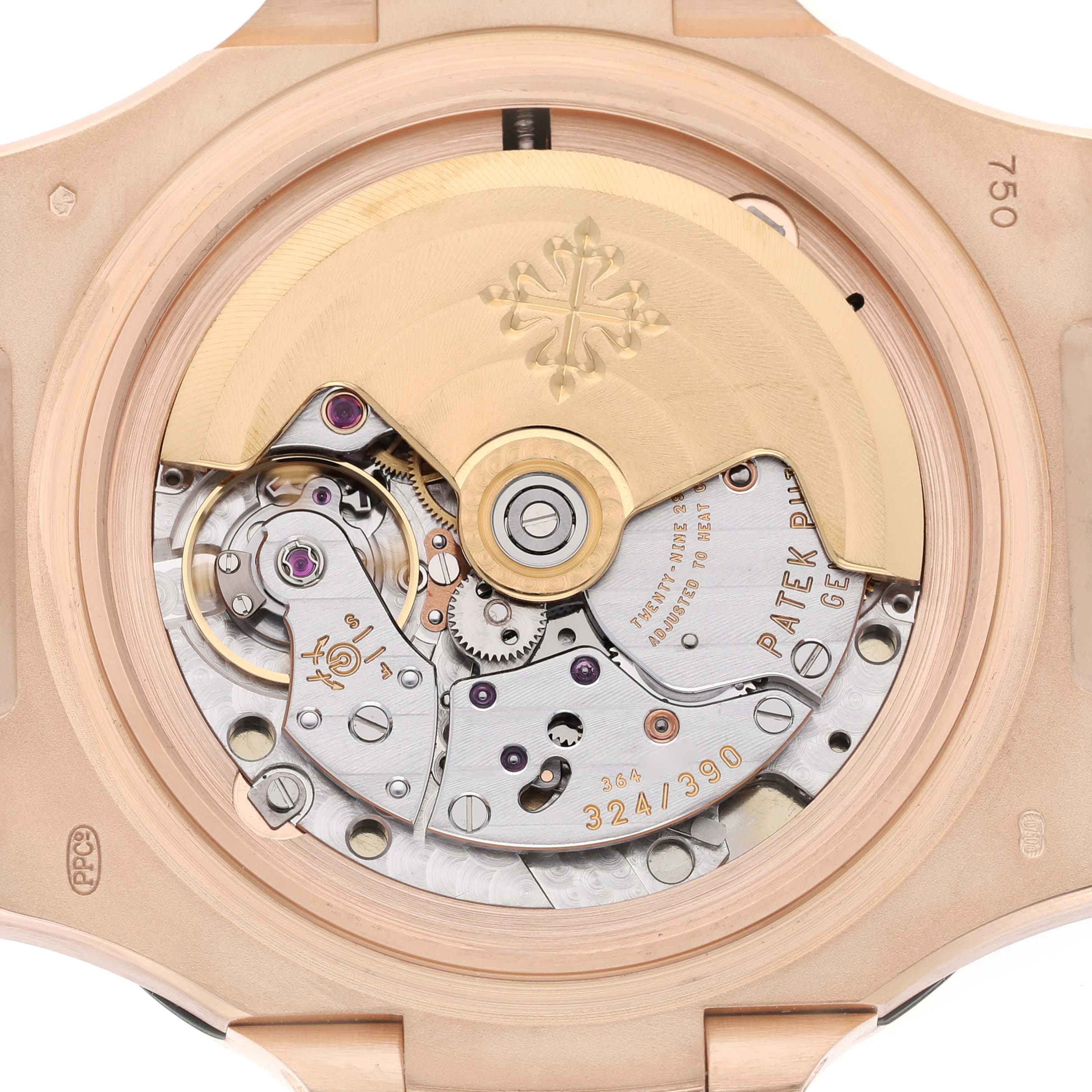 The image shows the back view of the Patek Philippe Nautilus 5711R-001 Men's Rose Gold Grey Dial watch, focusing on its intricate movement and rotor.