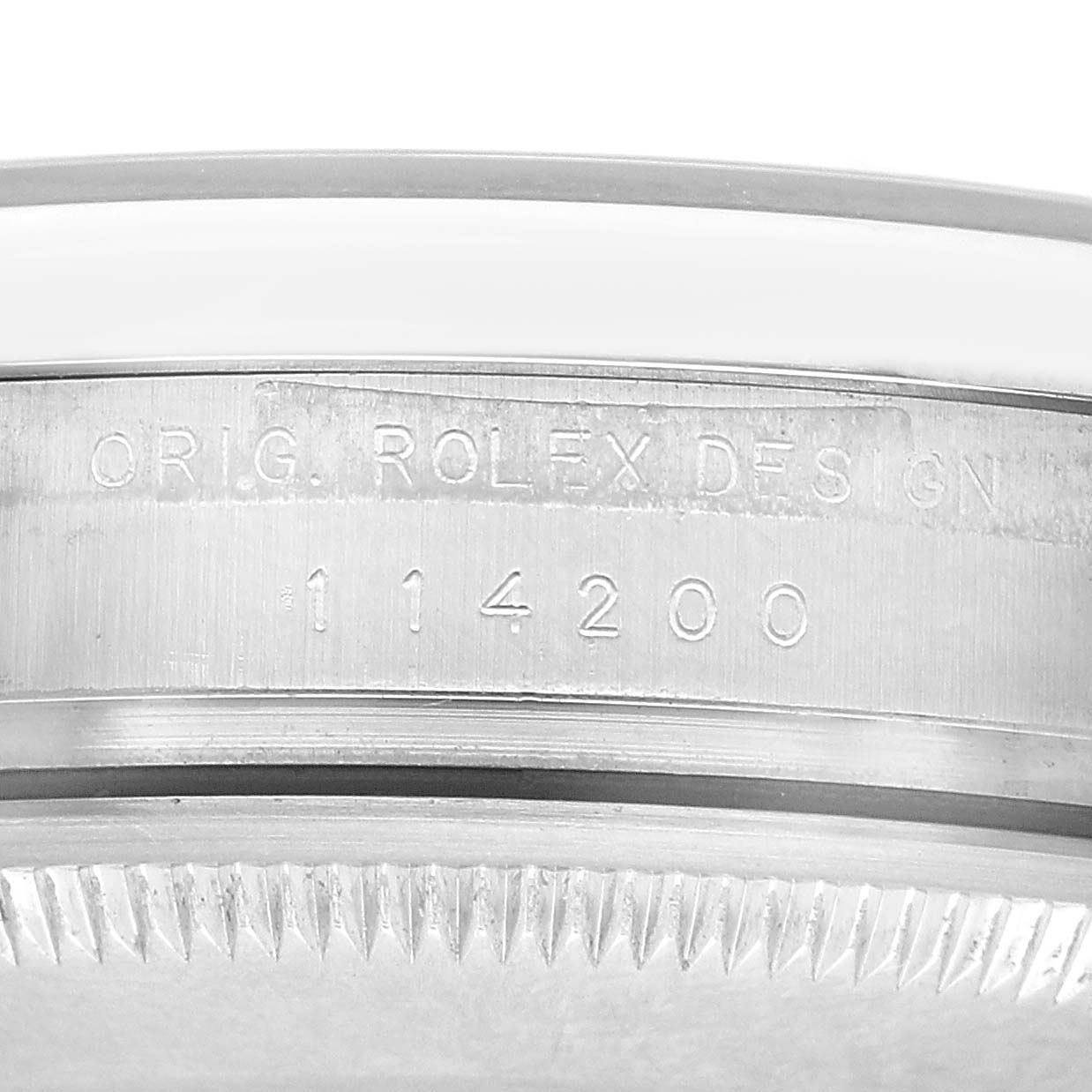The image shows a close-up side view of the case edge, displaying the model number and the words "Orig. Rolex Design" of the Rolex Air-King 114200 Men's Stainless Steel Blue Dial.