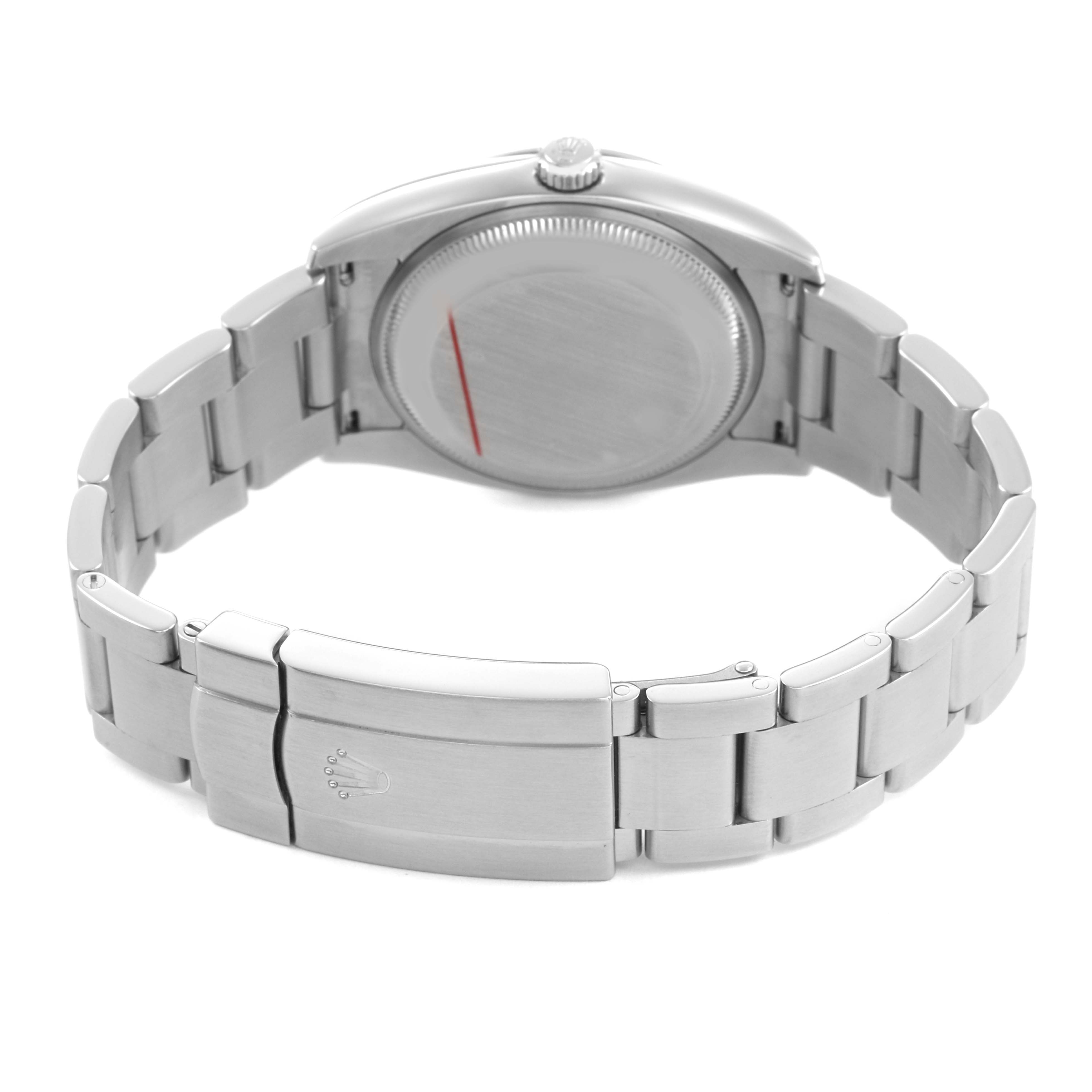 The Rolex Air-King 114200 Men's Stainless Steel Blue Dial watch is shown from the back, highlighting the case back, crown, and bracelet with a clasp.