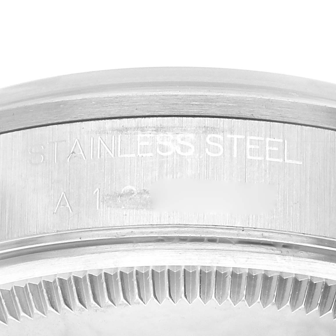This image shows a close-up of the stainless steel case back of a Rolex Air-King 14000 Men's Stainless Steel Silver Dial 14000 Men's Stainless Steel Silver Dial watch.