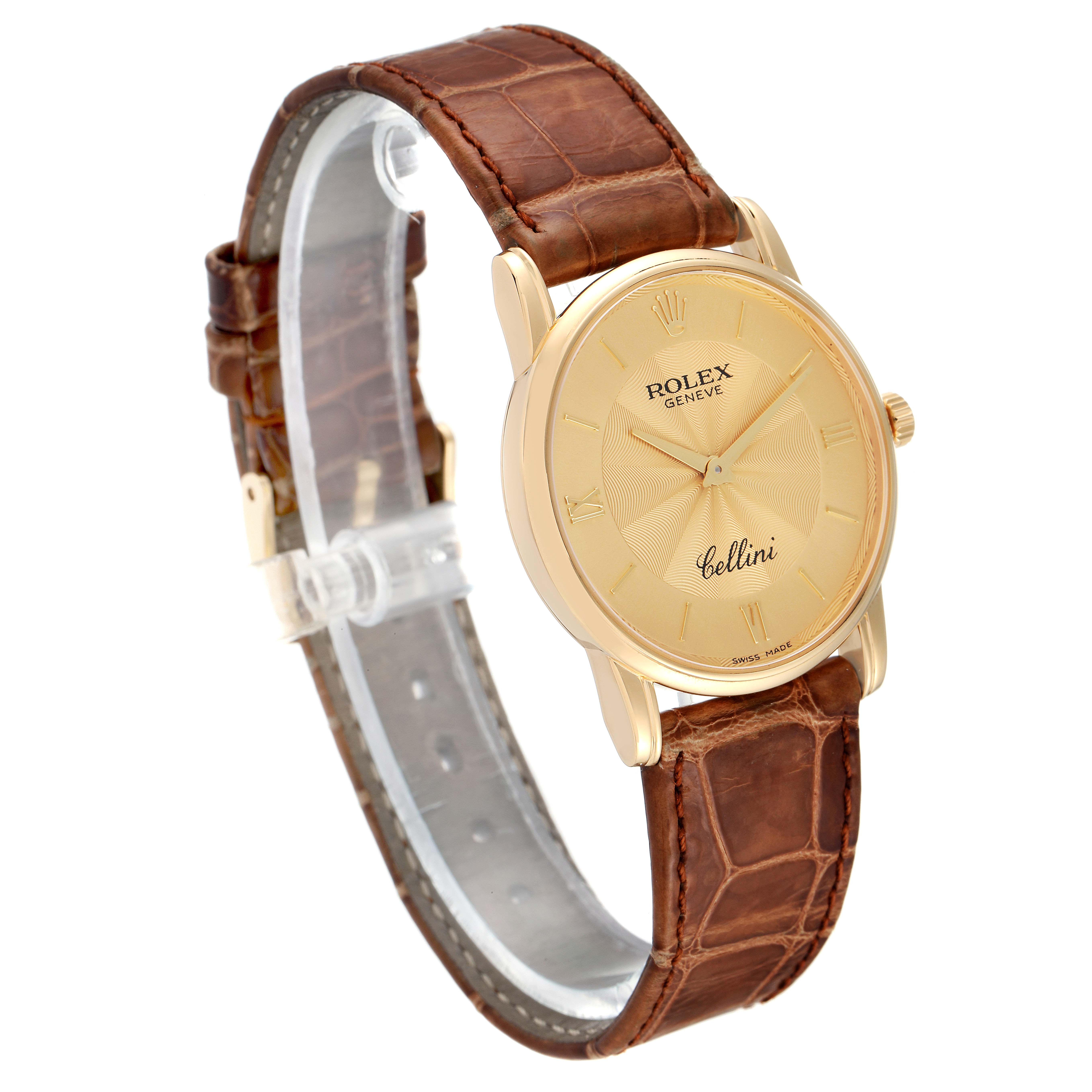 The Rolex Cellini 5116 Men's Yellow Gold Champagne Dial 5116 Men's Yellow Gold Champagne Dial watch is shown at a three-quarter angle, displaying the gold watch face, brown leather strap, and side crown.