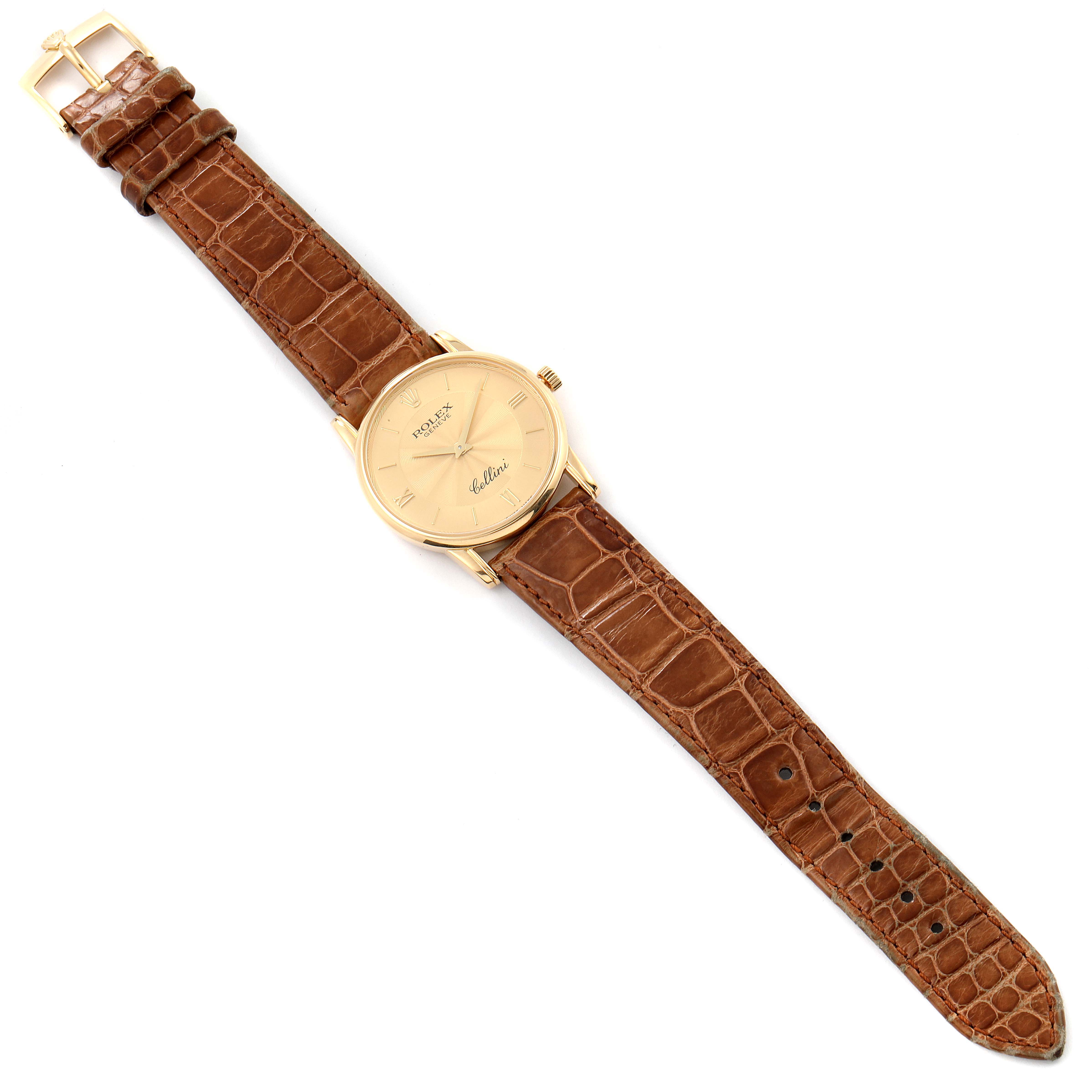 The image shows a Rolex Cellini 5116 Men's Yellow Gold Champagne Dial 5116 Men's Yellow Gold Champagne Dial watch viewed from above, highlighting its face, brown leather strap, and gold-tone buckle.
