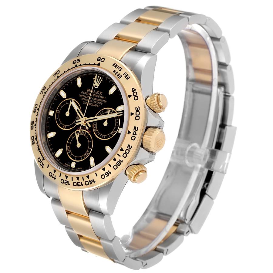The image shows a Rolex Daytona 116503 Men's Steel and Gold (two tone) Black Dial 116503 Men's Steel and Gold (two tone) Black Dial watch at an angle highlighting the case, bezel, crown, pushers, and bracelet.