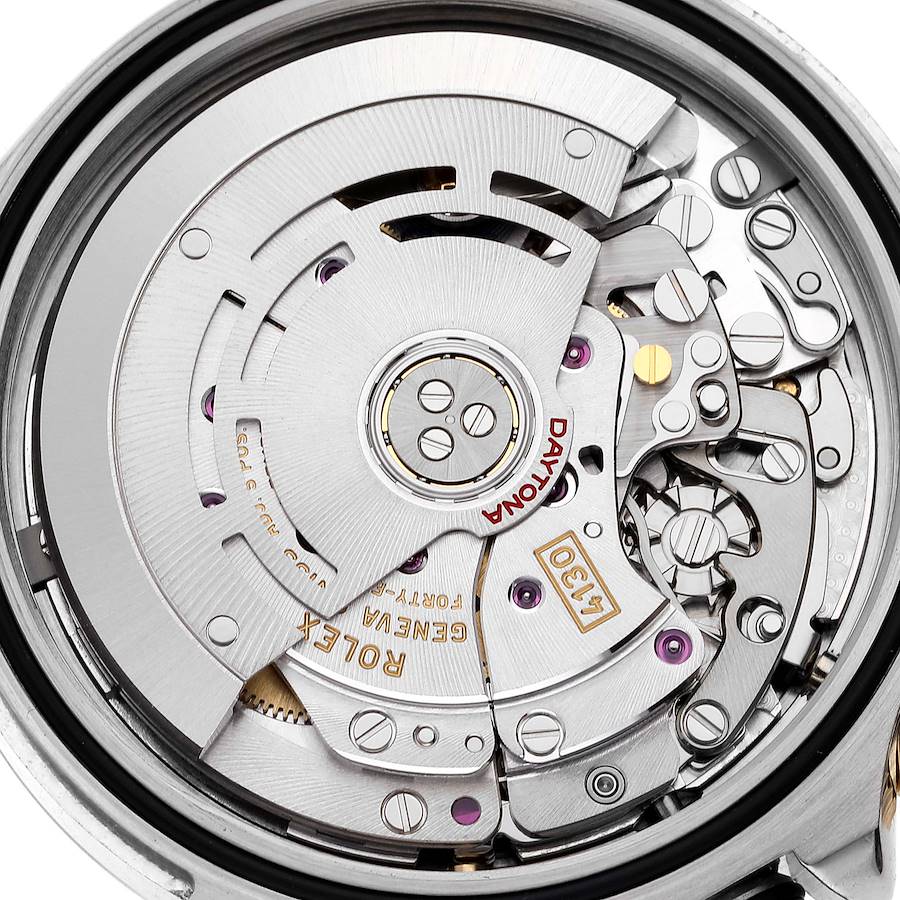 The image shows the internal mechanisms and movements of a Rolex Daytona 116503 Men's Steel and Gold (two tone) Black Dial 116503 Men's Steel and Gold (two tone) Black Dial watch from a close-up angle.
