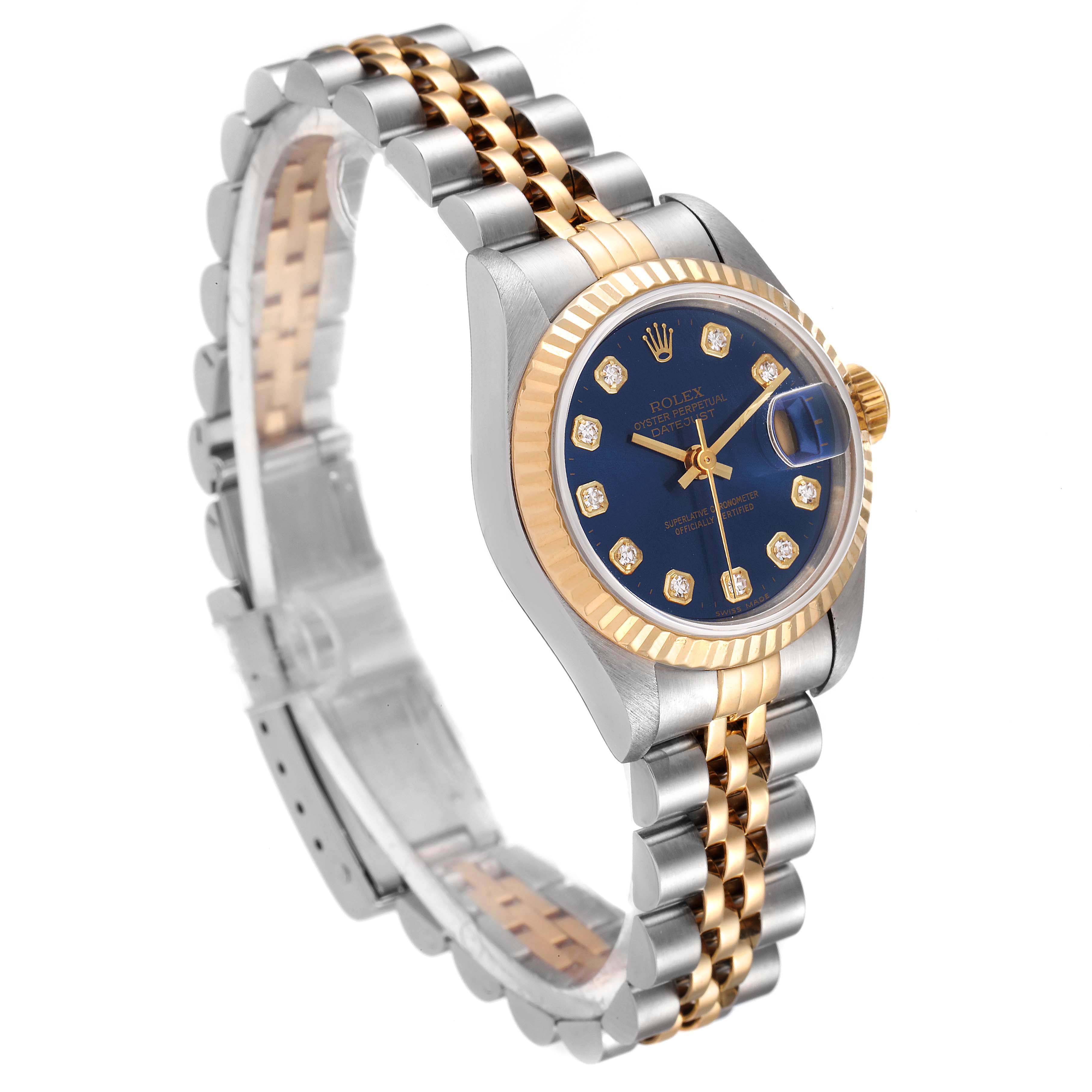 This Rolex Datejust 69173 Women's Steel and Gold (two tone) Blue Dial 69173 Women's Steel and Gold (two tone) Blue Dial watch is shown from a three-quarter angle, displaying its two-tone bracelet, fluted bezel, and blue diamond dial.