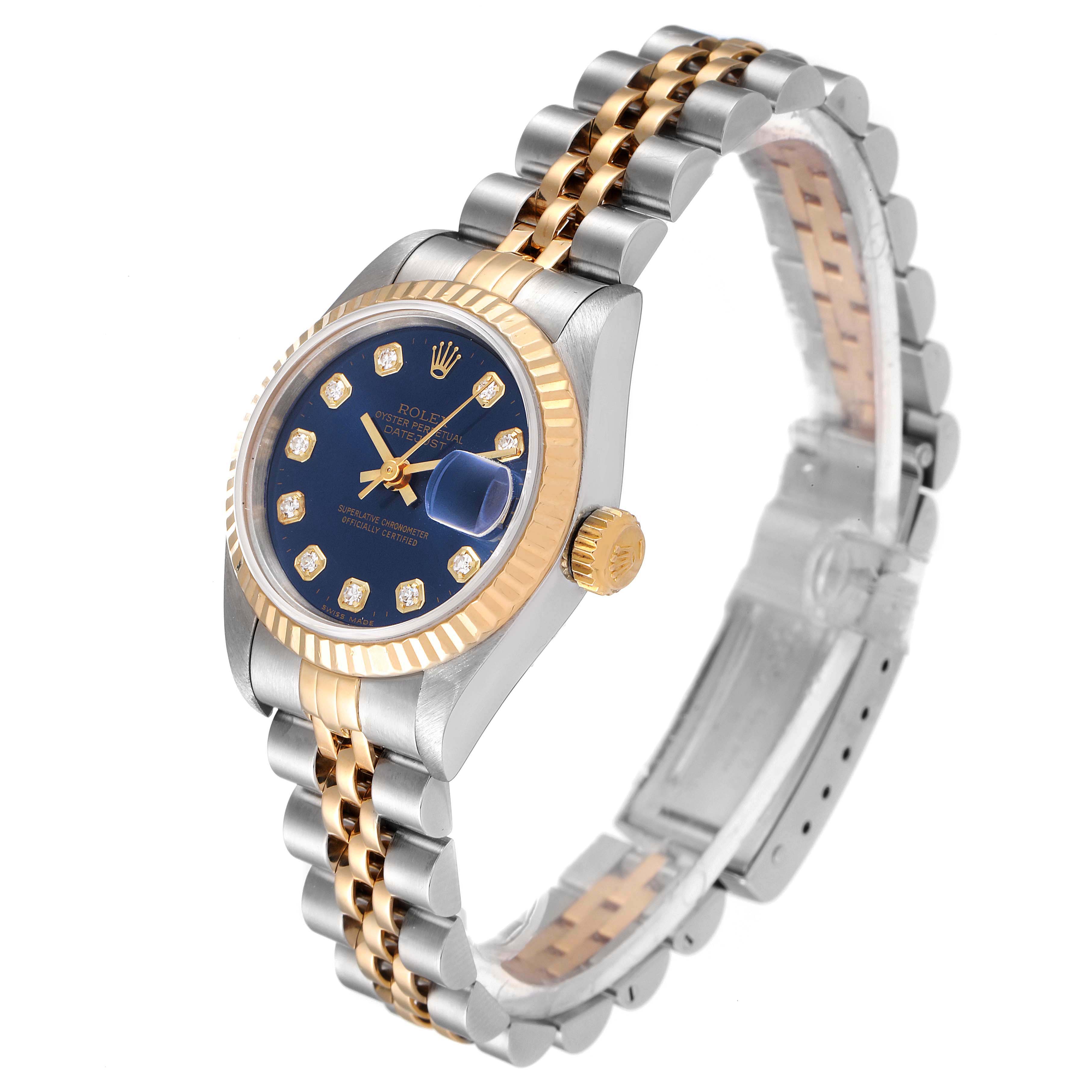 This image shows a Rolex Datejust 69173 Women's Steel and Gold (two tone) Blue Dial 69173 Women's Steel and Gold (two tone) Blue Dial watch at a three-quarter angle, highlighting its gold and silver bracelet, blue dial, and fluted bezel.