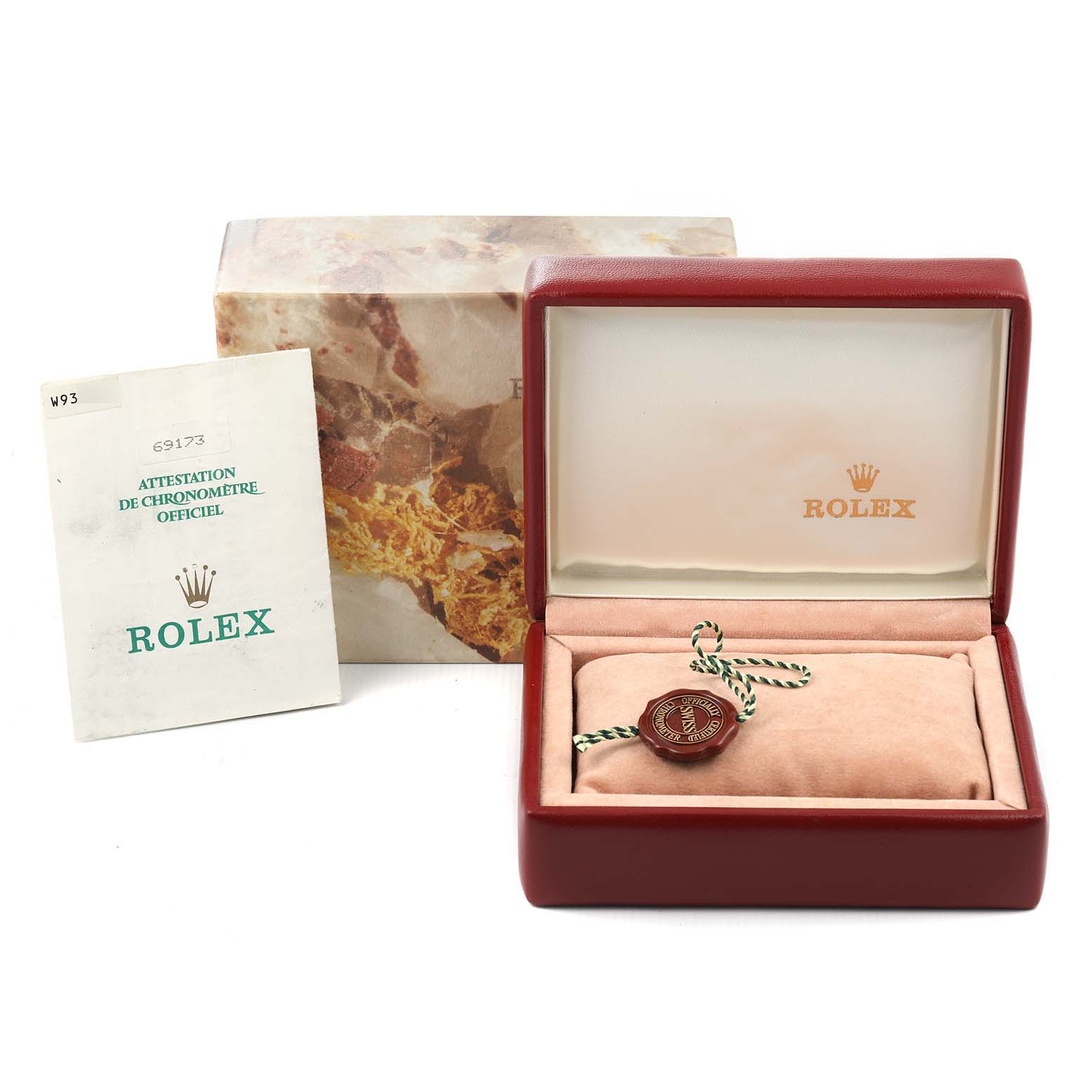 The image shows packaging and accessories of a Rolex Datejust 69173 Women's Steel and Gold (two tone) Blue Dial 69173 Women's Steel and Gold (two tone) Blue Dial with a watch box, tag, and official certification.