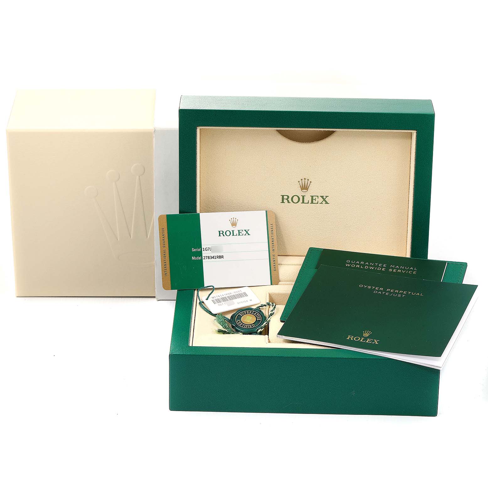 This image shows the packaging, warranty card, manuals, and accessories for a mid-size Rolex watch.